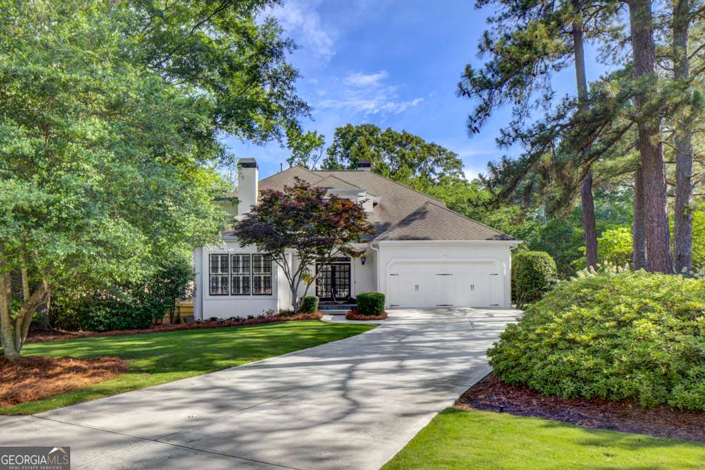 Traditional style home with unmatched curb appeal! It sits on a nice flat lot with a landscaped yard and a wrap around screened-in porch. Inside the home features freshly painted walls and cabinets, and re-finished hardwood floors. Primary + 2 additional bedrooms upstairs. There is a full finished basement which includes a game room, fitness room and en suite bedroom with new air ducts and HVAC. Brand new 50 gallon hot water heater. The newly replaced back deck overlooks a private fenced in yard. Located in the desirable Springlake neighborhood in Buckhead, and Morris Brandon school district! WALKING DISTANCE to Bobby Jones Golf Course, Bitsy Grant Tennis Center, Ellsworth Park, grocery stores and much more.