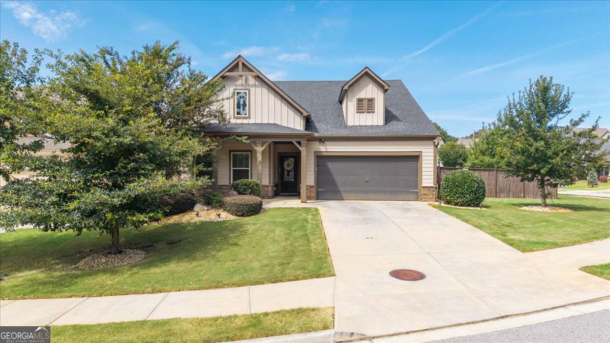 This spacious 5-bedroom, 3.5-bath home with a bonus room offers the perfect blend of comfort and convenience with 3,226 sq. ft. of living space. Situated on a corner lot in a quiet cul-de-sac, this property is designed for both everyday living and entertaining. The open-concept layout features a bright and inviting kitchen overlooking the living and dining areas, making it the heart of the home. The primary suite plus three additional bedrooms are located on the main level, offering true ease of living. Upstairs, you'll find a versatile bonus room and fifth bedroom, perfect for guests, a home office, or a media room. Enjoy outdoor living year-round on the screened-in back porch with plenty of space to relax or entertain. Location is a standout-just a quarter-mile walk to the Silver Comet Trail for biking and walking, and less than a half-mile from shopping, restaurants, and grocery stores. This home combines modern comfort, functionality, and convenience in one perfect package-don't miss your chance to make it yours!
