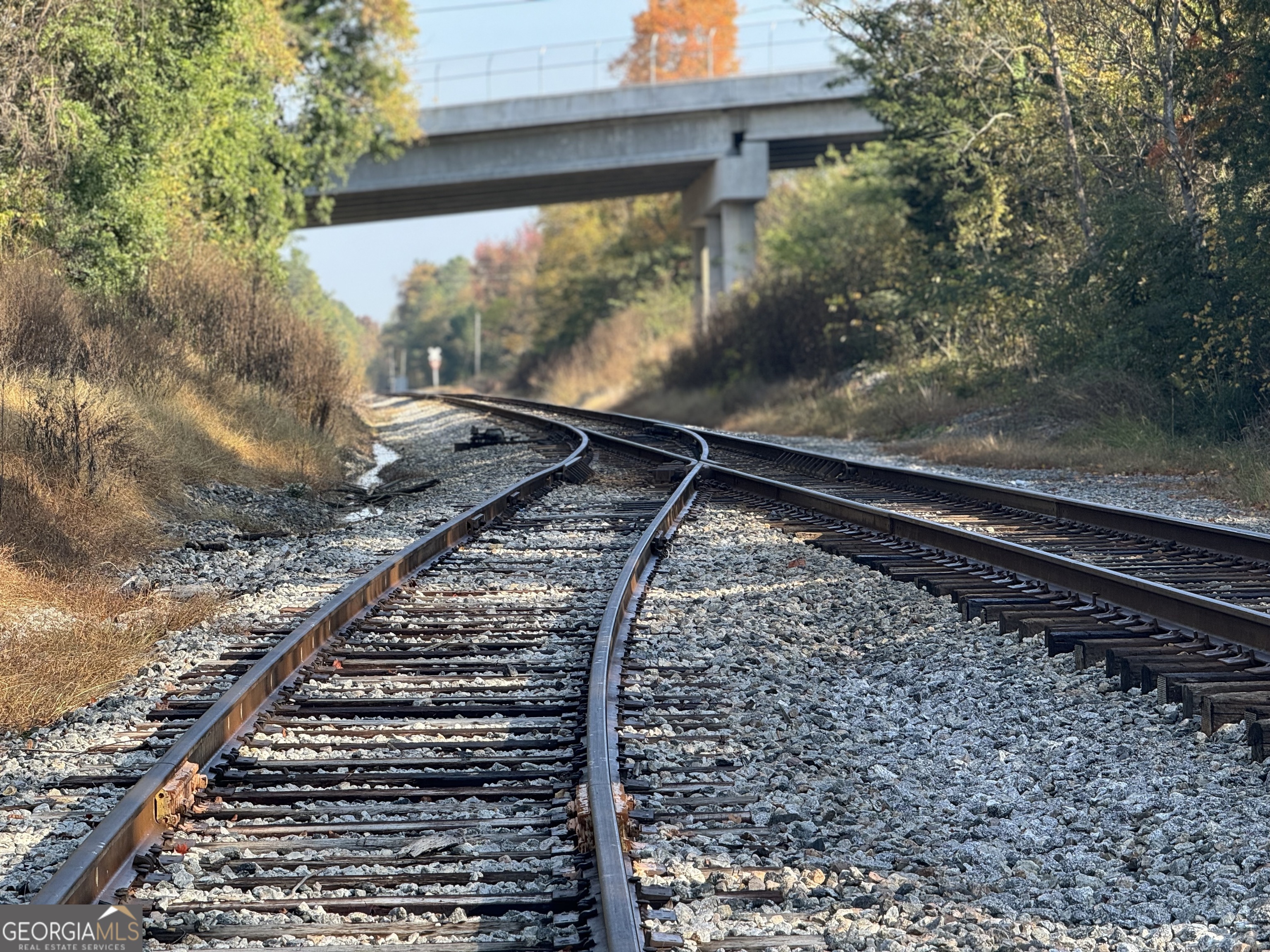 BUSINESS OWNERS AND INVESTORS, TAKE A LOOK AT THIS RARE OPPORTUNITY! THE MURRAY 90 OFFERS RAIL ACCESS!!! Located off Tennga Gregory Road in Crandall, GA is a unique, 90 acre property. The Murray County gem features more than 2,300 feet of a railroad spur off the main CSX mainline AND Rostex Airport, which includes a landing strip over 2,000 feet long! The property is zoned for industrial/manufacturing and is ready for a global business to set-up a facility. Access to the CSX mainline provides exactly what you need to move bulk material. You will find plenty of dirt available for whatever your development/construction needs may be. Additionally, a truck tipper is on site for loading rail cars and trucks. This commercial tract offers endless potential being conveniently located just over 90 miles from Knoxville, TN and approximately 105 miles from Atlanta. With ample road frontage, a railroad spur and aviation access, the Murray 90 is worth considering for your business! Additional land available.