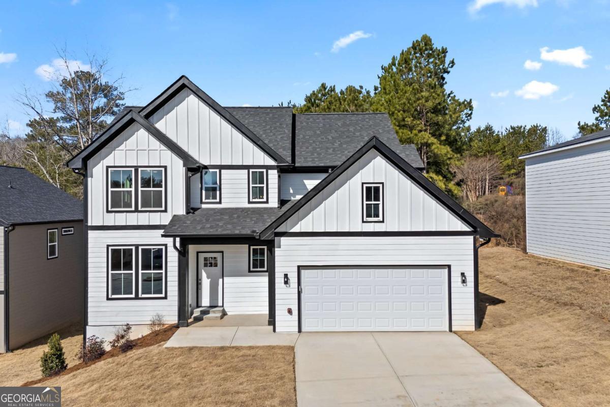 Welcome to this stunning NEW CONSTRUCTION 3-bedroom, 2.5 bath home, thoughtfully designed for both style and functionality. Experience true hardwood floors flowing throughout the home, complemented by stylish tile in the bathrooms and laundry room. The main floor greets you with a welcoming foyer, leading to a separate dining room and a beautifully appointed kitchen featuring ample white cabinetry, a large solid surface island, and countertops. The kitchen seamlessly flows into the living room, creating the perfect space for entertaining. An additional main-floor flex space offers endless possibilities - it can serve as extra storage, a mudroom, or a cozy office. The garage has been upgraded with an epoxy-coated floor for added durability and style. Abundant windows throughout the home allow natural light to pour in, creating a bright and airy atmosphere. Upstairs, you'll find three generously sized bedrooms, including a luxurious primary suite with a spacious en-suite bathroom featuring a double vanity, tile floors, a separate tub and shower, and a large walk-in closet. The two additional bedrooms each include walk-in closets and share a charming Jack-and-Jill bathroom, accessible through stylish sliding barn doors. This bathroom is complete with a double vanity, tile floors, and a tub/shower combo. A conveniently located, well-sized laundry room with tile flooring completes the upper level. For even more potential, this home sits on an unfinished basement, ready for your personal design touches. Don't miss the opportunity to make this exceptional home yours! Priced below appraised value and is available now!