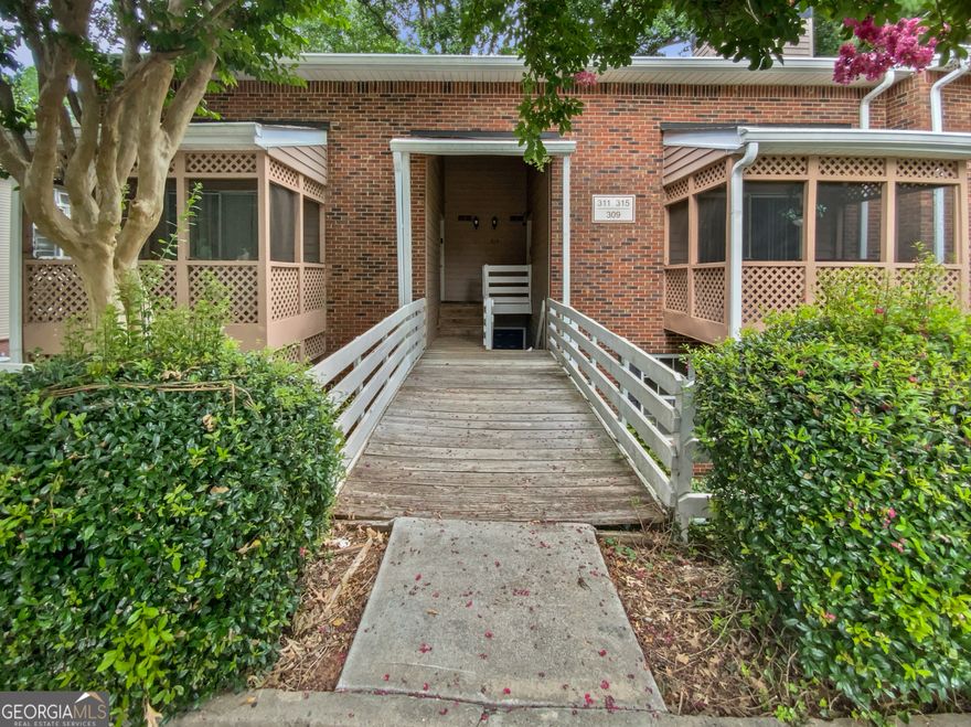 Welcome Home! This beautifully updated 3-bedroom, 2-bath condo in Roswell is back on the market and better than ever! Step into the inviting kitchen featuring sleek stone countertops, brand-new stainless steel appliances, a subway tile backsplash, and updated shaker-style cabinet doors. Gorgeous hardwood-style flooring flows throughout, adding warmth and sophistication. The spacious primary suite offers a walk-in closet and a private en suite bath.  Enjoy the perfect blend of nature and convenience at Martin's Landing, where you'll find a 2-mile path around a scenic 55-acre lake, miles of wooded trails, and access to the Chattahoochee River. Take advantage of community amenities including tennis and pickleball courts, swimming pools, and multiple clubhouses. This gem is move-in ready and waiting for your personal touch-come make it yours!
