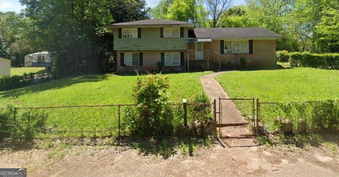 **A Hidden Gem with Endless Possibilities!** Don't let the exterior fool you-this mid-century, four-sided brick home is **WAY bigger than it looks!** Bring your offers for an incredible opportunity to craft your dream living space. Featuring **four generous bedrooms,** two baths, and a spacious den/family room, this home offers ample room for comfortable, everyday living. Set on a nearly **half-acre fenced corner lot,** you'll enjoy a wealth of outdoor space perfectly suited for relaxing or entertaining. With a bit of sweat equity, you can transform this house into your ideal haven, rich with mid-century charm. **Unleash your creativity and make this home truly yours!** Don't miss this chance to embrace its unique character. Call today to schedule your tour!