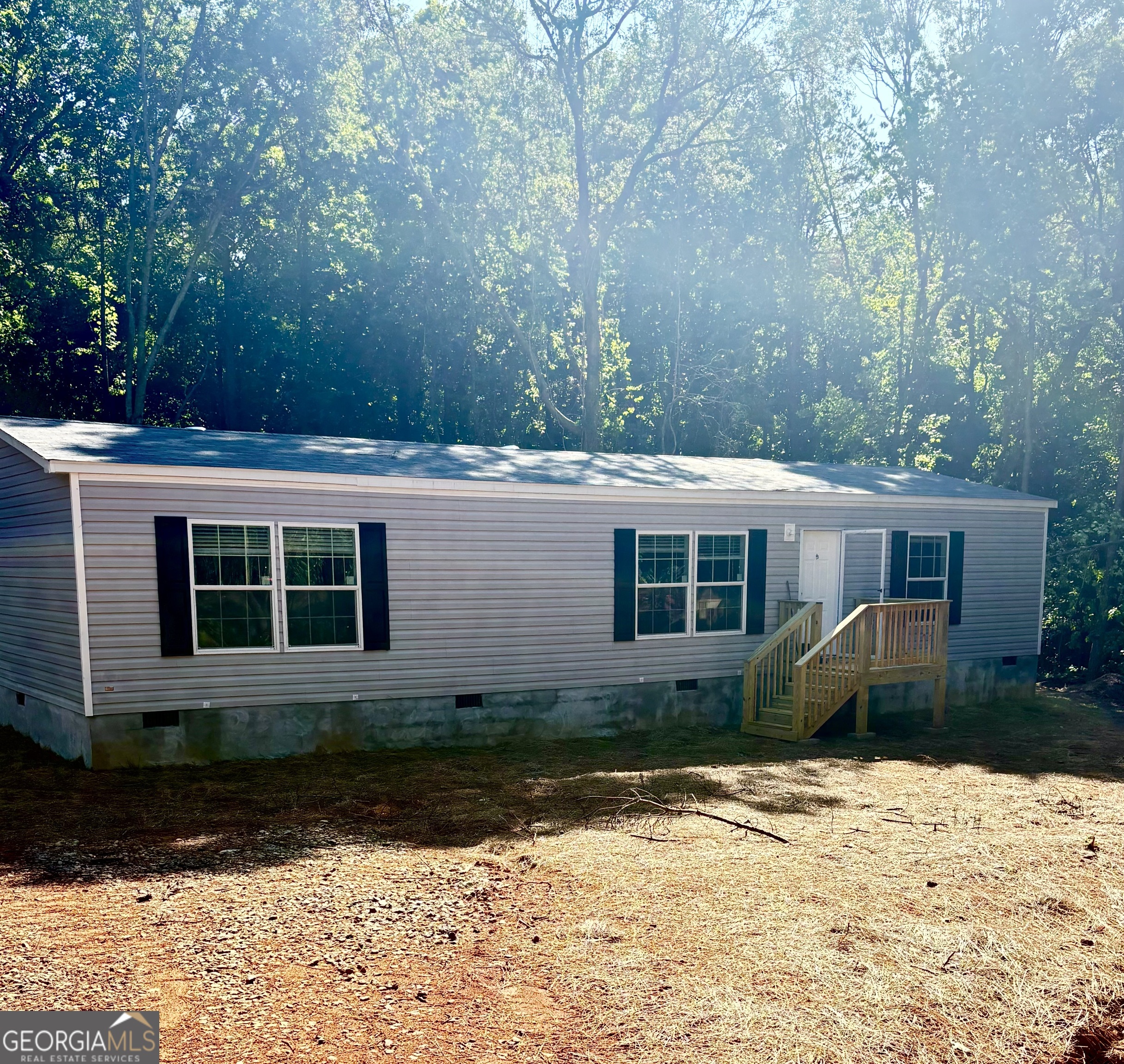 Move-In Ready Fleetwood Mobile Home on 3.5+ Acres in Hart County Enjoy the peace and privacy of over 3.5 acres with this brand-new, move-in-ready Fleetwood mobile home in beautiful Hart County. This freshly constructed home features 3 spacious bedrooms and 2 full bathrooms, designed with a modern open floor plan for maximum comfort and functionality. A dedicated mudroom and laundry room at the rear entrance add everyday convenience, while the 8x10 back deck offers a perfect space to unwind and enjoy your expansive backyard. The 6x6 front deck provides a welcoming entry point to your new home. Built to FHA standards, this home qualifies for both FHA and conventional financing. It will be placed on a permanent block foundation with a stucco finish, and the title will be retired-ensuring it meets the requirements for a permanent residence. Please note: Photos show a similar model on another lot (Deer Chase Drive); actual finishes may vary. For details on financing and preferred lenders, contact us at 850-572-3287.