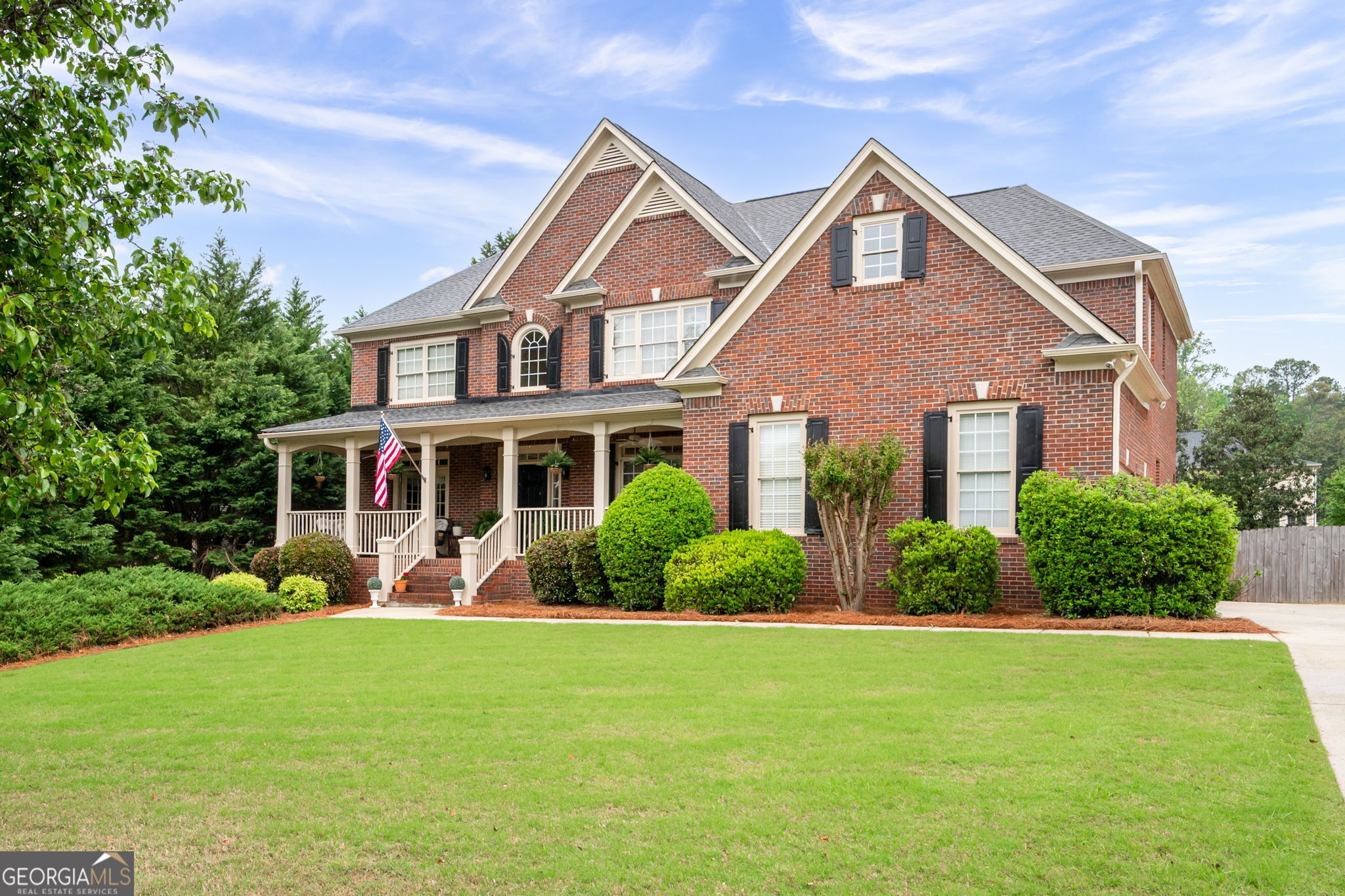 Prime Marietta location! Beautifully maintained three-sided brick home in desirable McDaniell Farm. This spacious 5-bedroom, 4-bathroom home has a full unfinished basement that is stubbed for a bathroom. The home welcomes you with a stately covered brick front porch. Step inside to find a classic layout with a formal living room and dining room with butlers pantry-ideal for entertaining or hosting holiday gatherings. The heart of the home is the impressive two-story great room, filled with natural light from soaring windows, creating a bright and inviting space. The updated kitchen features an island, granite countertops, brand-new appliances, and breakfast area providing a stylish and functional layout for everyday cooking or entertaining. The laundry room is conveniently located nearby, and the home offers two staircases-one off the entryway and another from the family room-offering easy access to the second floor. A guest bedroom with a full bathroom on the main floor provides convenience and privacy for visitors or a perfect home office option. Upstairs, the expansive primary suite is a true retreat with a tray ceiling, a cozy sitting area, a luxurious ensuite bath with a separate jetted tub and shower, and an oversized walk-in closet. A Jack and Jill bathroom connects two additional bedrooms, while a fourth bedroom enjoys its own private full bathroom. The home sits on a great flat lot with a newly built back deck, perfect for enjoying outdoor gatherings or morning coffee. Additional updates include two new AC units and furnace (2024) and a newer hot water heater (2022), ensuring peace of mind and modern comfort. Located near the community clubhouse and pool, and just minutes from local schools, shopping, and dining, this home is the perfect blend of space, style, and location. Don't miss the opportunity to make this your forever home in the heart of Marietta!