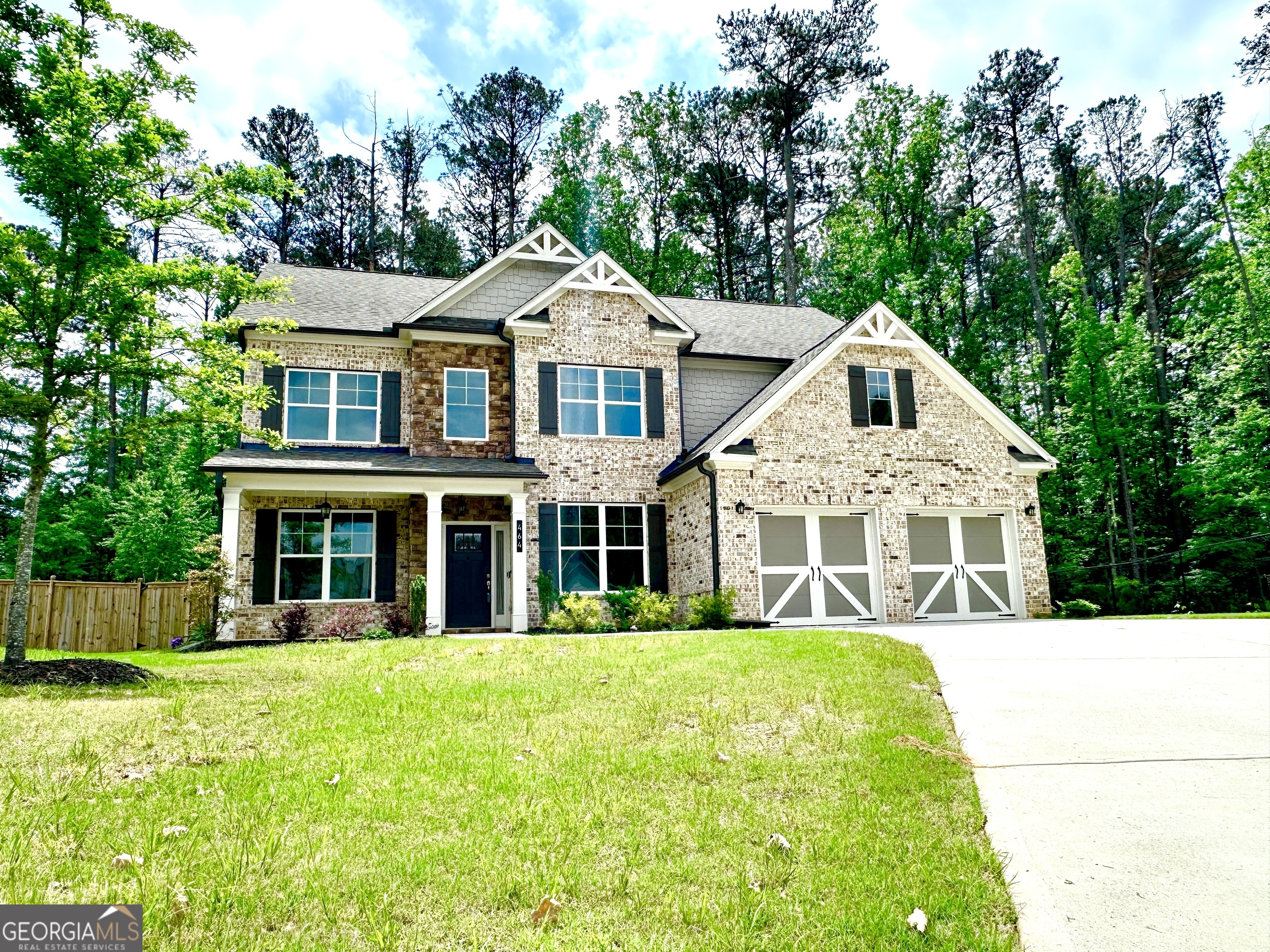 This home is the beautiful Georgetown floor plan by Paran Homes. It is a two-story home that features 5 bedrooms, 4 bathrooms and a 2-car front-entry and kitchen-level entry garage. On the exterior, it features a full front porch, covered rear patio and the spectacular salt-water swimming pool with fountains and an LED lighting system that is also gas heated for year round enjoyment. It also features a fully fenced yard. The interior's main floor is perfect for entertaining with an open floor plan, gourmet kitchen that flows into the great room. The kitchen features a huge granite prep island, 42-inch cabinets, a cooktop and double ovens. There is also a guest en suite on the main level. The second floor has an owner's suite with sitting area and secondary bedrooms. The homesite is a premium cul-de-sac location. This home is located in a top-rated school district offering exceptional educational opportunities and a strong sense of community.