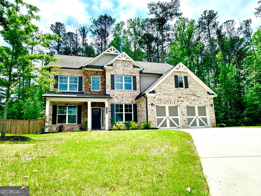 This home is the beautiful Georgetown floor plan by Paran Homes. It is a two-story home that features 5 bedrooms, 4 bathrooms and a 2-car front-entry and kitchen-level entry garage. On the exterior, it features a full front porch, covered rear patio and the spectacular salt-water swimming pool with fountains and an LED lighting system that is also gas heated for year round enjoyment. It also features a fully fenced yard. The interior's main floor is perfect for entertaining with an open floor plan, gourmet kitchen that flows into the great room. The kitchen features a huge granite prep island, 42-inch cabinets, a cooktop and double ovens. There is also a guest en suite on the main level. The second floor has an owner's suite with sitting area and secondary bedrooms. The homesite is a premium cul-de-sac location. This home is located in a top-rated school district offering exceptional educational opportunities and a strong sense of community.