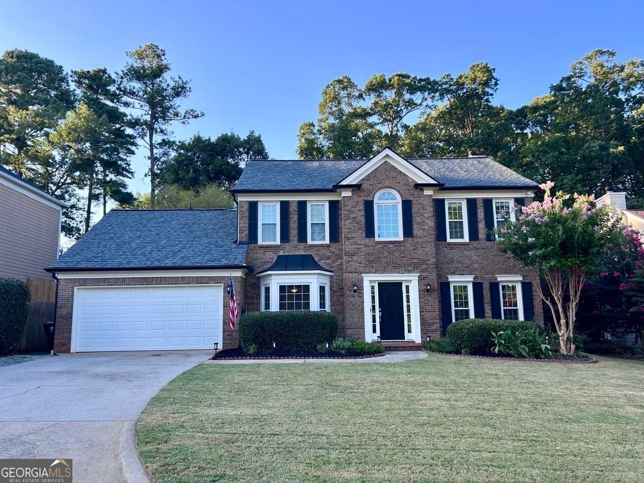 Professional interior and exterior images will be available August 2. First showings available to be scheduled August 2 after 1:00 P.M. Welcome to this stunning home that embodies the perfect blend of classic and modern charm. This meticulously maintained two-story home features a brick facade that exudes warmth and sophistication. Upon arrival, you are greeted by a beautifully landscaped front yard, meticulously manicured grass, and vibrant flora that create a welcoming atmosphere. The inviting entrance leads you into a spacious two-story foyer, where you will immediately appreciate the thoughtful design and flow of the layout. The home boasts an ample amount of windows, allowing natural light to flood the living spaces, making each room feel bright and airy. You will find a cozy and inviting family room, perfect for gatherings or quiet evenings, seamlessly connecting to the chef's delight kitchen, featuring modern appliances and ample counter space for meal preparation, striking the perfect balance between functionality and style. Enjoy family meals in the charming eat-in kitchen, where a picturesque bay window frames tranquil views of your private, serene backyard. Step outside to an enchanting private backyard that is designed for relaxation and entertainment. A covered patio invites you to grill, dine alfresco or simply unwind after a long day. The fenced yard offers decorative stone steps leading to a versatile terraced yard-ideal for cozy evenings around a fire pit, cultivating your favorite vegetables or creating a play area for children. With a blend of indoor comforts and outdoor tranquility, this residence offers an idyllic lifestyle for those seeking both relaxation and entertainment. Don't miss out on the chance to own this piece of paradise that combines comfort, style, and exceptional outdoor living in one fabulous property.
