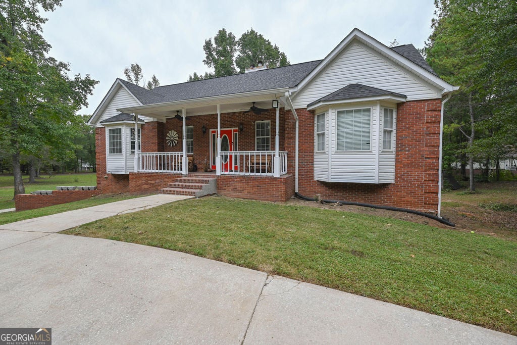 Photo of 220 Marcella Avenue, Sharpsburg, GA 30277 (MLS # 10870713)
