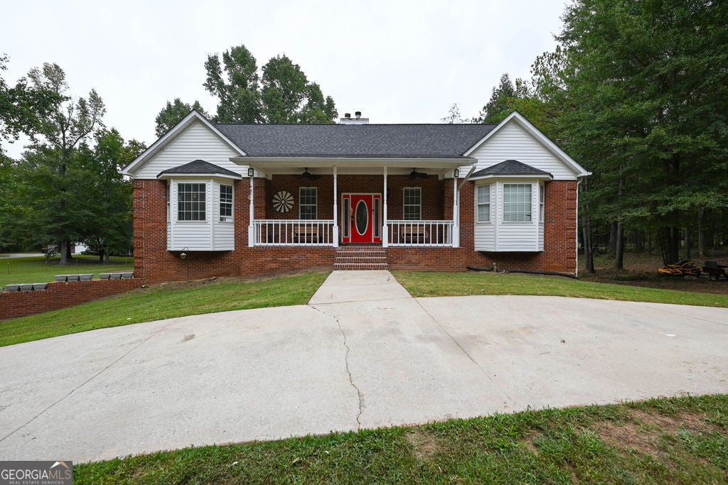Photo of 220 Marcella Avenue, Sharpsburg, GA 30277 (MLS # 10870713)