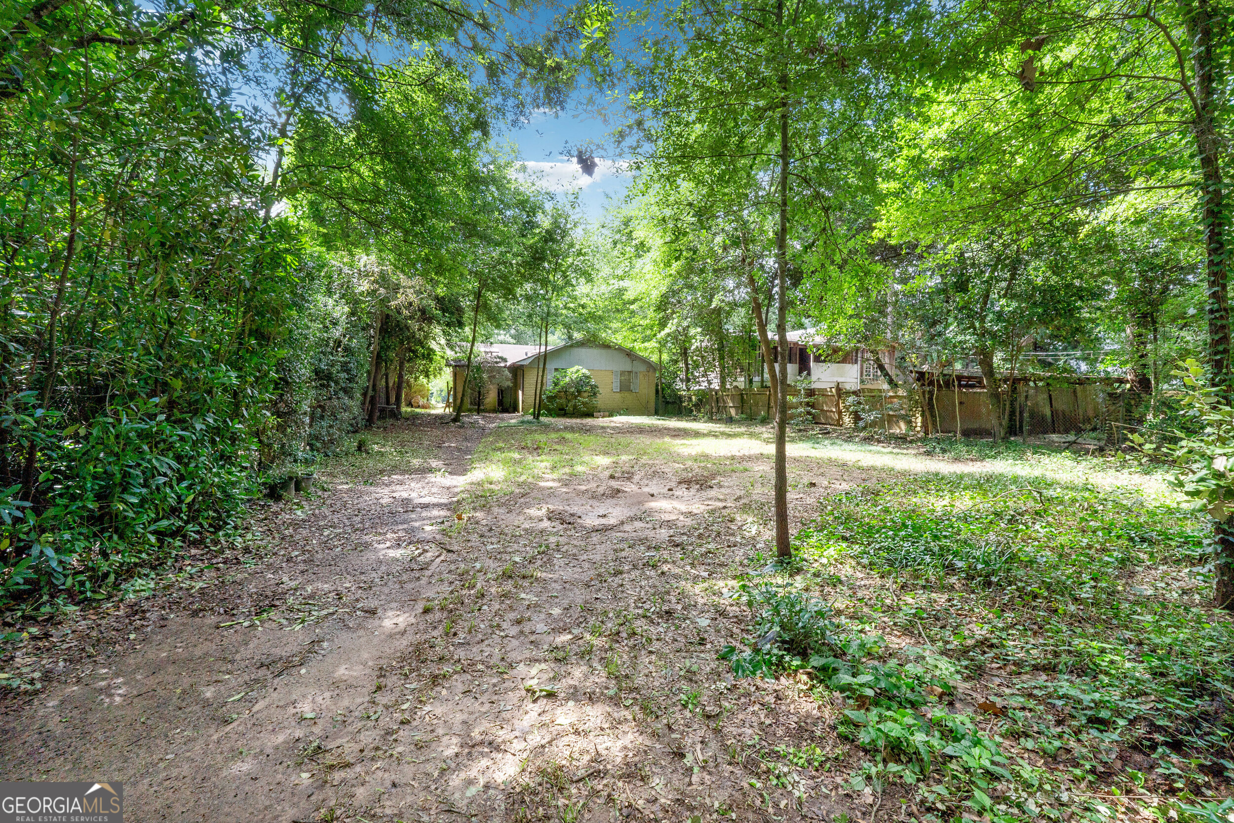 Unbeatable Location & Connectivity. Discover an extraordinary chance to create your dream home on one of Vinings' most desirable streets. This private and quiet lot offers an unbeatable location, less than 4 miles from The Battery at Truist Park and just a short stroll from the vibrant heart of Vinings. Here, you'll find an array of acclaimed restaurants, charming boutiques, and convenient shops. Despite its serene setting, the property boasts incredible connectivity, just 1.9 miles from both I-285 and I-75, ensuring an easy commute throughout the Atlanta metro area. Beyond its exceptional walkability to Vinings, this property offers a lifestyle of convenience and prestige. Enjoy the proximity to Cochise Club and the many educational institutions. A significant advantage is the Cobb County address, which often means lower property taxes compared to Fulton County, a key consideration for homeowners. The true value of this offering lies in this rare parcel of land, boasting highly coveted waterfront footage on the picturesque Chattahoochee River. This provides a serene backdrop and endless possibilities for outdoor enjoyment, from kayaking to simply enjoying the natural beauty. The existing structure on the property is ready for demolition, clearing the way for you to design and build your custom residence to capitalize on the stunning river views and unparalleled lifestyle. All essential utilities, including sewer, are already accessible to the site, streamlining your building process. Don't miss this unique opportunity to secure your slice of Vinings paradise and create the luxury home you've always envisioned.