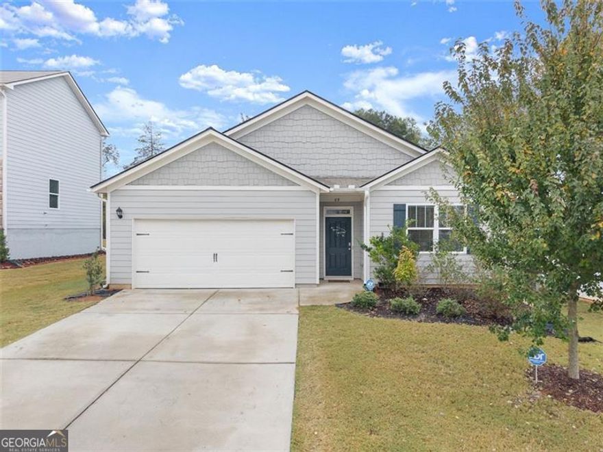 Welcome to this stunning 4-bedroom, 2-bath ranch-style home in the charming community of Walnut Grove. Designed for comfort and style, this move-in-ready residence features an open, spacious layout ideal for modern living. The bright living area flows seamlessly into the inviting kitchen, which features hardwood flooring, granite countertops, and a large island perfect for entertaining. This floor plan includes a serene owner's suite with a double vanity, a relaxing garden tub, and an oversized walk-in closet, along with three additional bedrooms that provide ample space for family or guests. Step outside to enjoy a private backyard complete with a covered patio. The community offers fantastic amenities, including a pool, park, and playground, enhancing your everyday living experience. This home feels like new and provides the perfect blend of modern design and comfort. Conveniently located near downtown Pendergrass, with easy access to shopping, dining, and I-85.