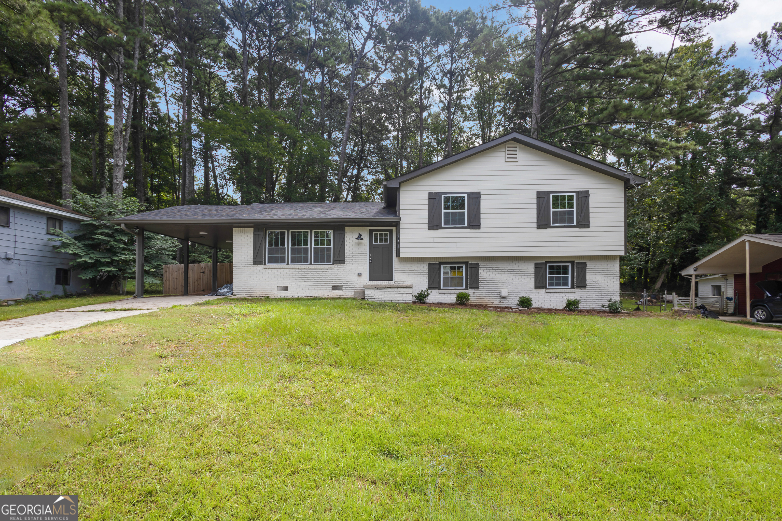 Discover this inviting 3-bedroom, 2-bath home in a quiet and established Conley neighborhood. The spacious floor plan features a comfortable living room with a fireplace, a bright dining area, and a kitchen with plenty of cabinet space. The primary suite includes its own private bath, while the additional bedrooms offer flexibility for family, guests, or home office needs. A large backyard provides room for outdoor entertaining, gardening, or play. Conveniently located near I-285, I-675, and quick routes into Atlanta, this home offers both accessibility and potential at a great value. Make a great deal even better with Massive savings through special loan programs with the Preferred Lender Envoy Mortgage with Aubrey Wilcox! Ask the Listing Team for the introduction for up to 100% Financing or even interest rates in the 4s! Seller shall provide Stainless Steel appliances for kitchen at no additional cost to buyer!