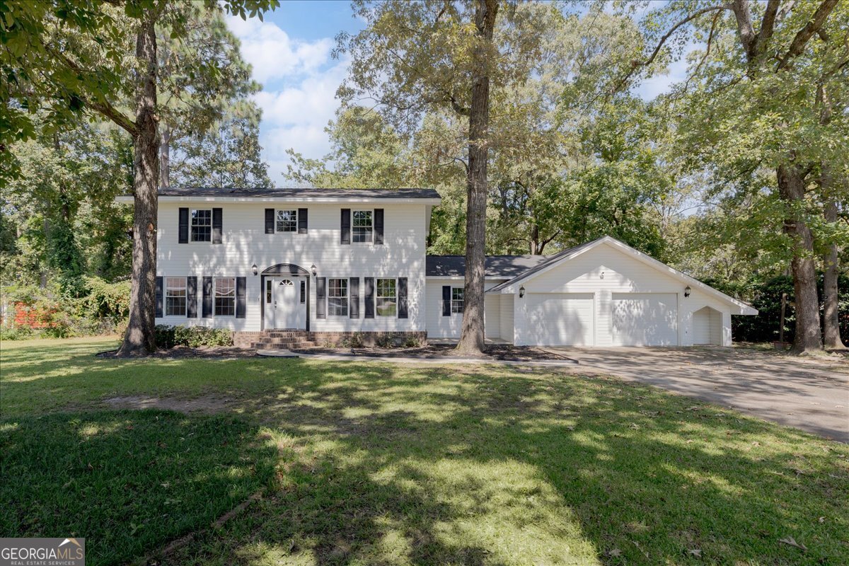 Welcome to 305 Tarrasa Drive - The Jewel of the Neighborhood! Nestled on a beautifully shaded cul-de-sac lot in the heart of Warner Robins, this stately Southern charmer offers the perfect blend of space, convenience, and timeless appeal. Just minutes from I-75, shopping, dining, and Robins Air Force Base, you'll love being close to everything while still enjoying the quiet comfort of this established neighborhood. Boasting over 2,600 sq. ft., this home features 4 spacious bedrooms, 3.5 bathrooms, and an in-law suite on the main level-ideal for multi-generational living or hosting guests. The primary suite is a true retreat, complete with a newly remodeled bathroom, a gorgeous stand-up tile shower, and a walk-in closet. The heart of the home is the kitchen, recently refreshed with granite countertops, stainless steel appliances, and fresh paint throughout. Multiple living spaces and plenty of extra storage make this home as functional as it is inviting. With its stately facade and welcoming charm, this residence stands out as the crown jewel of the neighborhood. Whether you're relaxing on the shaded lot or entertaining friends and family, 305 Tarrasa Drive is ready to welcome you home.