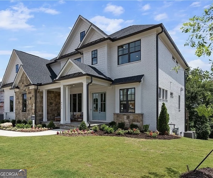 Welcome to this stunning, upgraded home that seamlessly blends modern elegance with everyday comfort! From the moment you step inside, you'll be captivated by the rich hardwood floors that flow throughout the entire home, replacing all previous carpeting. The thoughtfully designed floor plan offers a spacious and inviting atmosphere, perfect for both relaxation and entertaining. The primary suite is a true retreat, now enhanced with ceiling speakers in the bedroom and spa-like bathroom for a luxurious ambiance. Two additional guest rooms also feature upgraded hardwood flooring. The home's lighting has been elevated with stylish new fixtures, and under-deck fans and lighting provide the perfect outdoor oasis. Security and smart technology upgrades make this home as functional as it is beautiful, including an advanced security system, exterior perimeter cameras, two interior cameras, smart locks, and basement window sensors for added peace of mind. The fully finished basement is a standout feature, offering a seamless extension of living space. The unfinished section was transformed with drywall, baseboards, and crown molding, creating a polished and inviting environment. The expanded entryway enhances accessibility, while a full secondary kitchen-complete with an island crafted by the same cabinet maker as the main kitchen-adds incredible versatility. This gourmet space includes a dishwasher, electric stove, over-the-range microwave, and refrigerator. For added convenience, additional washer/dryer connections have been installed, creating a secondary laundry area.
