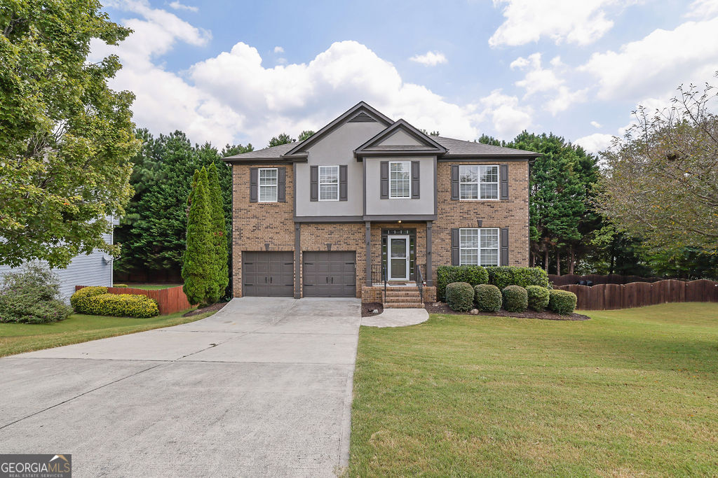 Stunning 6-Bedroom, 3.5-Bath Southern Charmer in Mineral Springs Crossing! Welcome to one of the largest and most impressive homes in the highly coveted Mineral Springs Crossing community! From the moment you step inside the inviting entry foyer, you'll feel right at home. A formal dining room and additional flex space-perfect for a home office-set the tone for versatile living. The spacious family room features plush luxury carpet and a gorgeous stone fireplace, ideal for cozy movie nights. An open view to the kitchen keeps you connected with guests while entertaining. The chef's kitchen offers abundant cabinetry, a center island for cooking or extra seating, and sleek stainless-steel appliances. Step outside to a large deck with tranquil lighting-your favorite spot for morning coffee or evening mocktails. Upstairs, prepare to be wowed by the oversized primary suite! This retreat boasts a striking trey ceiling, generous sitting area, and a spa-like en-suite with a custom-tile luxury shower, soaking tub, double vanity, and walk-in closet. Four additional bedrooms and extra bathrooms provide space for everyone. The fully finished basement is a dream for multi-generational living or rental income. Complete with its own entrance, full kitchen, living and rec areas, flex space for a gym or media room, a sixth bedroom, full bath with step-in shower, laundry with stacked unit, and large walk-in closet-this level has it all. BRAND NEW ROOF 9/3/25! Enjoy the covered flagstone patio for summer BBQs or cozy bonfires. Set on a large lot with a spacious backyard, side yard, and two storage sheds, this property truly has it all. Located in sought-after Auburn, close to schools, shopping, and dining-don't miss your chance to own this exceptional home. Schedule your private showing TODAY!