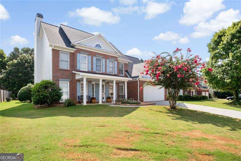 Welcome to this beautifully maintained 5-bedroom, 3-bathroom brick-front home that blends classic charm and modern comfort. In quiet Hunters Glen, well-kept neighborhood. As you enter, you're greeted by a bright and welcoming foyer with wood flooring that flows seamlessly throughout the main level. French doors open into a versatile front room-ideal as a home office or playroom. Step into the formal dining room, perfect for gatherings or holiday meals. It's a warm and welcoming space you'll love hosting in. The main level features a bright and open floor plan with a cozy living room centered around a fireplace. The kitchen is equipped with sleek stainless steel appliances, white cabinetry, and a wrap-around breakfast bar-perfect for morning coffee. The adjoining breakfast area is surrounded by windows, offering ample natural light. One of the standout features of this home is the private downstairs bedroom with a full bathroom-perfect for guests, in-laws, or anyone who prefers no stairs. Upstairs, you'll find spacious bedrooms. The soft pink room is a sweet setup for a kid's room or nursery. The primary suite is a relaxing retreat with a tray ceiling, walk-in closet, and a full en-suite bath. Enjoy a soak in the large tub, a quick rinse in the stand-up shower, and get ready for the day at the dual vanity with plenty of counter space. The roof was replaced in 2021, the furnace was replaced in 2022 & the water heater was replaced 2020. You'll enjoy the location with easy access to shopping, restaurants.