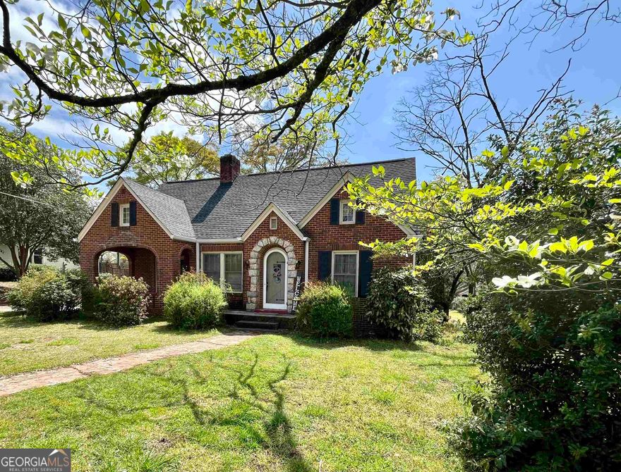 Coming soon! Charming 3-bedroom & 1-bathroom 4-sided brick ranch home that was built in 1936 resting on a 1 acre +/- lot just outside the Monticello Square. This home features a brand-new roof & gutters, new paint inside and out, the original wood floors, curved hallway, new floors in the bathroom, high ceilings, 4-fireplaces, separate large family/living room, dining room, mud room and kitchen. The back yard is private with plenty of parking, a new deck, plenty of green grass and privacy.  The property is being sold "as is".
