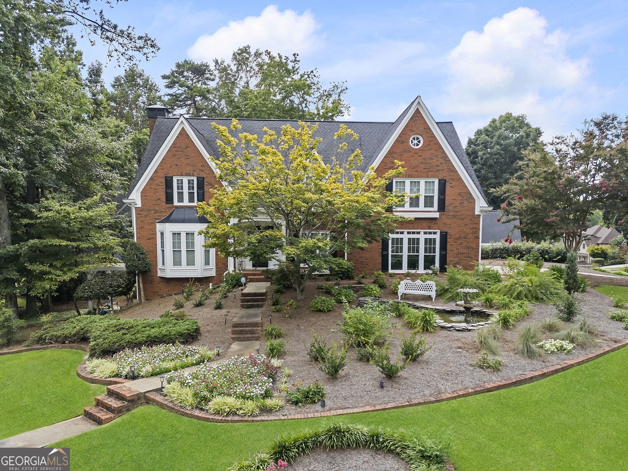 Welcome to this beautifully maintained former model home, featuring a rare and thoughtfully designed floorplan -- one of only a few like it in the community. Nestled within the highly desirable Brookstone Golf and Country Club neighborhood and zoned for top-rated West Cobb schools, this 5-bedroom residence offers space, comfort, and style. The main level includes a formal living room, formal dining room, and a warm, inviting family room perfect for relaxing or entertaining. The recently renovated kitchen boasts sleek Bosch appliances, updated cabinetry, stylish backsplash, and a spacious breakfast area. Upstairs, you'll find four generously sized bedrooms and three full baths, each tucked into its own private corner of the home. The luxurious owner's suite features a stunning spa-inspired bath with a newly tiled shower, soaking tub, dual vanities, and gleaming quartz countertops. The finished terrace level offers even more flexibility with an additional bedroom, a half bath, a large den or game room, and an extra space ideal for a home office or playroom. Step outside to a beautifully landscaped, fully fenced backyard -- perfect for outdoor enjoyment and privacy. This home reflects true pride of ownership and includes numerous thoughtful upgrades throughout. Brookstone offers an optional HOA with access to amenities such as a pool, tennis courts, playground, and a baseball field. Additionally, the optional Country Club features a championship golf course, restaurant, and clubhouse. Just around the corner are restaurants, a library, post office, shopping and more. Don't miss this unique opportunity to own a one-of-a-kind home in one of West Cobb's premier communities!