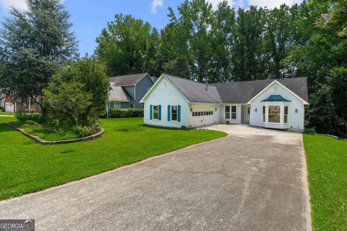 Welcome to 565 Clearwater Pl, Lawrenceville, GA 30044! This spacious 4-bedroom, 2-bathroom home offers 2,850 sq ft of comfortable living space and is situated in a prime location with no HOA.    As you step inside, you'll be greeted by beautiful tall vaulted ceilings that enhance the open and airy feel of the home. The interior features newly renovated bathrooms, with the master bathroom being a true highlight. It boasts a new stand-up shower, stylish vanity, modern fixtures, a garden tub, new flooring, and fresh paint, providing a luxurious retreat within your own home.    The roof, only 8 years old, ensures durability and peace of mind for years to come. Step outside to the enclosed sunscreen deck, perfect for relaxing and entertaining year-round.    While the home does need approximately 1,200 sq ft of new flooring and new carpet in the bedrooms, it is priced with these improvements in mind, offering a fantastic opportunity to customize and add your personal touch and TLC. Ask agent about possible concessions to cover cost of new flooring and paint (we have quotes to get the job done)!    Don't miss this chance to own a charming home with beautiful vaulted ceilings in a desirable neighborhood without the restrictions of an HOA.