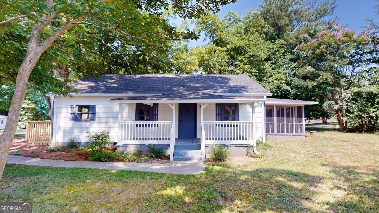Welcome Home to 3355 Caleb Road in Snellville, GA. Nestled on a serene 1.1-acre lot, this charming home welcomes you with the beauty of mature oak and pecan trees, creating a peaceful canopy and offering plenty of shade as you relax on the brand-new deck. Inside, this beautifully updated 2-bedroom, 1.5-bath home features fresh interior paint, new luxury vinyl plank flooring, and stylish new hardware and light fixtures throughout. The kitchen is fully renovated with brand-new cabinets, countertops, and a complete set of new appliances-including a washer and dryer for your convenience. Enjoy your mornings or unwind in the evenings on the spacious screened-in porch-perfect for coffee, quiet conversations, or simply enjoying a good book. The property also offers an enclosed workshop with power, ideal for hobbies or storage, as well as a shed with three lean-tos to meet all your outdoor needs. 3355 Caleb Road combines comfort, character, and thoughtful updates-ready for you to call it home. Schedule your showing today!