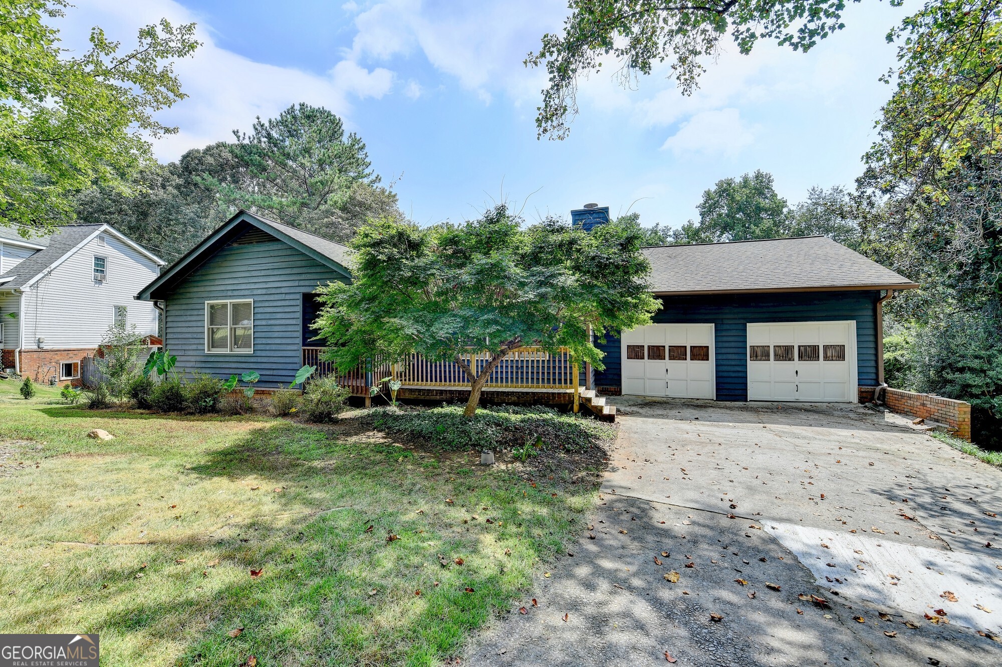 Welcome to this inviting ranch that blends comfort, space, and endless possibilities. Step inside to a bright, open layout filled with natural light perfect for everyday living and entertaining. The large unfinished basement offers incredible flexibility for storage, a home gym, or your favorite hobbies. Outside, you'll love the generous yard with a peaceful creek at the back of the property, creating a beautiful setting for gardening, play, or simply soaking up nature. The oversized deck is ideal for relaxing or hosting friends, while the included washer and dryer add convenience. This home is ready to welcome you with room to grow and enjoy!