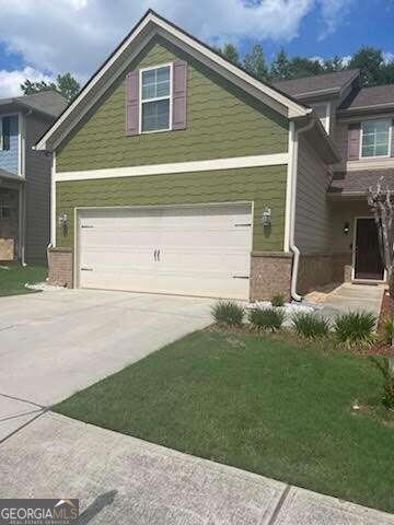 This resale open 4 bedroom 2.5 bath Monarch floor plan is beautiful featuring hardwood floors on the lower level, a huge gourmet kitchen with nice island, granite counter-tops, tile back splash, wrought iron rails and a private backyard. This homesite is nestled in the heart of downtown Lithonia near the post office. There is easy access to the Stonecrest Mall and I-20.