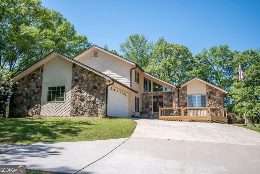 Tucked away in the gently rolling hills of Madison County, and situated on 2.95 lush acres is a uniquely designed contemporary home with newly painted exterior enhancing its appeal. Set amongst mature shade trees, this private setting is one to behold with established landscaping in full bloom and pastoral manicured lawns perfect for fencing. Boasting move-in ready condition, this gracious design features a formal layout with multiple living areas, creating the ideal plan for entertaining or just everyday comfortable living. Gleaming hardwood floors expand throughout adding a touch of warmth and durability. Additional formal features, such as plantation shutters, chair railing, decorative chandeliers, recessed and custom focus lighting can also be found sprinkled throughout. The welcoming layout is comprised of a spacious, vaulted-ceiling living room flanking the foyer, ideal for hosting guests. Allow the foyer to usher you to the formal dining room, perfect for banquet feasts, or the secondary living space. The true heart of the home, the great room captures your attention with the custom, pieced-stone fireplace accompanied by custom hearth and mantle spanning the wall. This focal point adds the perfect touch of charm to this cozy living space. The home chef can interact and serve with ease with only the breakfast bar separating the kitchen from the great room. Crafted with tons of space to work your magic, the spacious kitchen features custom-stained cabinets with "pull-out storage at every turn, as well as expansive counters aiding in meal prep. The kitchen is also accented with a tile backsplash, tile floors and complete appliance package including wall oven and gas range. When youre ready to retire after along day, retreat to the second floor where youll find 3 bedrooms and 2 full baths. Carpet-free, each bedroom is upgraded with hardwood floors, ceiling-fan light fixtures and ample closet space. Created to standout, the primary suite boasts extra space for a sitting area and an oversized, private full bath complete with separate shower and garden tub. The ideal storage space is provided with the unfinished basement, and even provides options for a workshop with the drive-up parking pad and double door rear access. Features extend to the exterior where multiple outdoor living options are found with the new front deck, covered rear porch, covered balcony off the main level, or the rear, open-air patio perfect for cranking up the BBQ. Additionally, added storage options or space to house your lawn equipment is provided with the storage shed. This inviting home hosted on a park-like setting offers tranquility and comfort   and ready to welcome you home!
