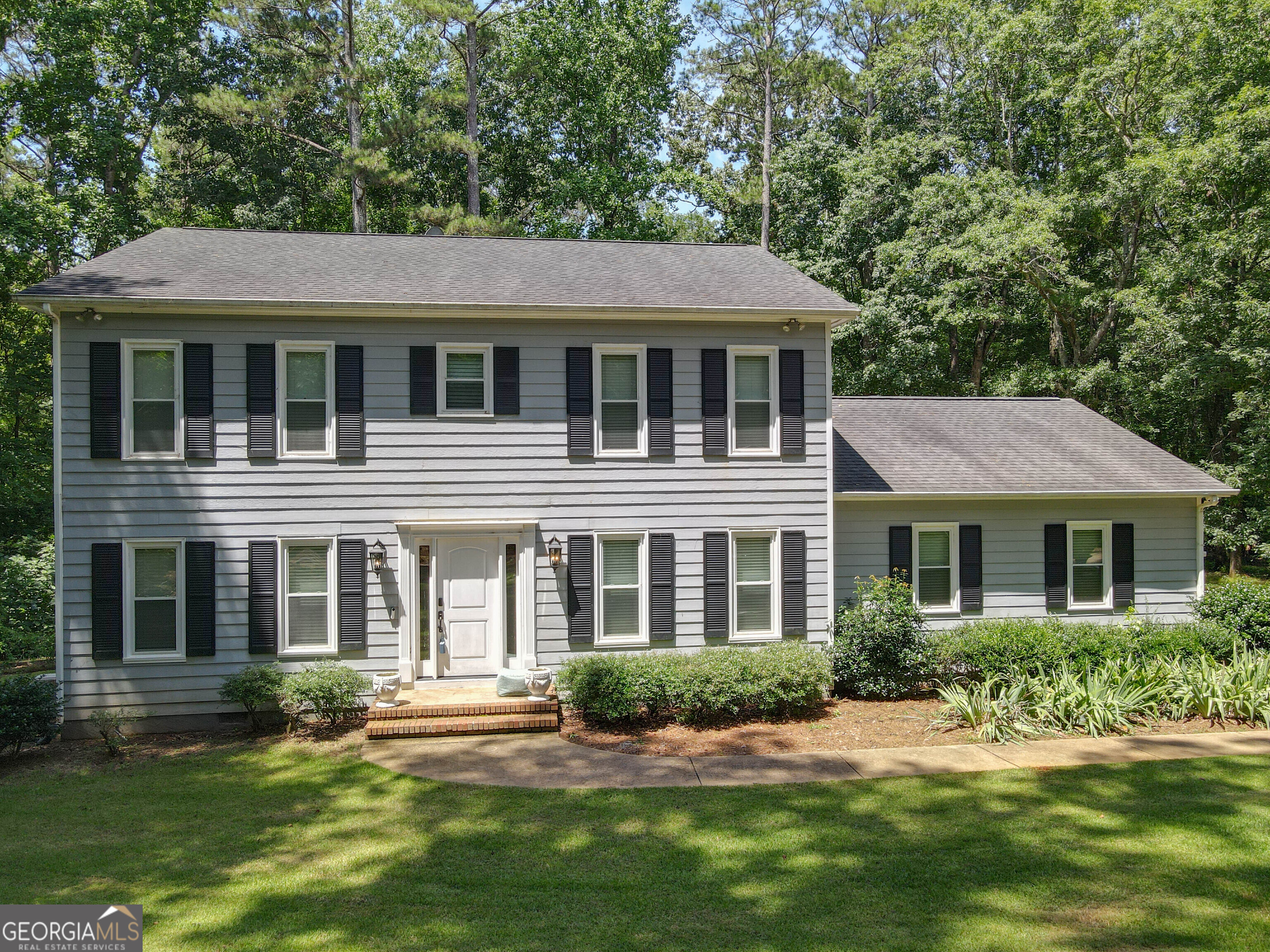 Lakefront Living at its Best! This well-kept home is situated right on West Point Lake, conveniently close to both Highland Marina and McGee Access. The property boasts a welcoming foyer, beautiful hardwood floors, and two spacious master suites, along with a charming sunroom. The large living area features a cozy brick fireplace. The kitchen offers solid surface countertops, a stylish subway tile backsplash, and stainless steel appliances. The generous dining room is perfect for hosting family gatherings or holiday meals. In addition to the two master suites, the home also includes two additional bedrooms and two additional bathrooms, providing ample space for family and guests. The expansive master suite features separate walk-in closets for him and her, while the master bath is equipped with dual vanities and a custom-tiled shower. With four walk-in closets, there's no shortage of storage space. New AC Unit!! The back deck provides an excellent space for entertaining, and the lovely landscaping includes fruit trees. While the home offers lake access, you also have a full 1 acre to explore!!