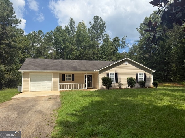 This beautifully updated 3 bedroom, 2 bath ranch nestled on 1.44 acres offers comfort, space, and convenience just minutes from Jackson Lake and Hwy 36! Perfectly blending modern updates with timeless charm, this home features an expansive family room with vaulted ceilings, ideal for hosting gatherings or cozy nights in. The eat-in kitchen boasts generous cabinetry, new appliances (refrigerator, range, and dishwasher), and new vinyl flooring. Enjoy the comfort of new carpet throughout the home, adding warmth and style. The spacious primary suite offers a peaceful retreat with a tray ceiling, walk-in closet, and a private en suite bath complete with a tub/shower combo and new vinyl flooring. The secondary bedrooms are generously sized, each featuring large windows, ceiling fan light fixtures, and plenty of natural light. Outside, enjoy a large backyard perfect for outdoor activities, gardening, or simply enjoying the tranquility of your surroundings. Additional features include a 1-car garage, ample driveway parking, and a serene, private setting. Don't miss the opportunity to own this charming home! Your peaceful retreat awaits!