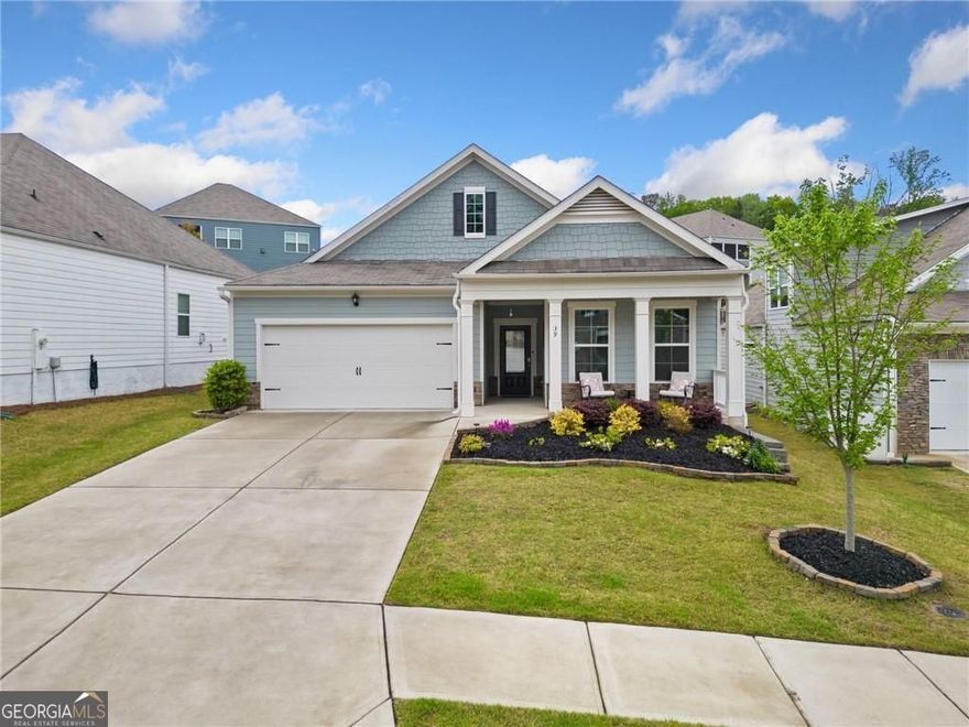 Welcome to this beautifully maintained stepless ranch home located in the highly desirable Glynshyre Active Adult 55+ neighborhood in Dallas. Set on a professionally landscaped lot, this 3-bedroom, 2-bath gem offers comfort, convenience, and curb appeal.    Enjoy morning coffee on the charming front porch overlooking the manicured yard. Inside, the open-concept floor plan connects the living room, dining area, and kitchen, filled with natural light and ideal for entertaining. The living room features a gas log fireplace with gas starter, adding warmth and ambiance.    The kitchen is a chef's dream with granite countertops, white cabinetry, oversized island, walk-in corner pantry, gas range, microwave, dishwasher, refrigerator, and tile backsplash. The primary suite includes a walk-in closet, double vanities, and an oversized tile shower.    Enjoy peaceful evenings on the screened back porch, or take in sunset views from the tiered backyard with stone steps leading to a private overlook. This home also features a whole house Generac generator, sprinkler system, landscape lighting, wood blinds, and an oversized laundry room. The home is designed for easy and secure living with a Qolsys smart panel with Bluetooth capability, Wi-Fi integration, Z-wave access and cellular connectivity. It has a Kwikset Smart lock on the front door which can be open by a combination or smart device as well as a Honeywell T6 Pro Z-Wave Thermostat accessible wirelessly. Also included is the SkyBell front doorbell with video and sound.    The 2-car garage with a stone facade adds charm and storage, while Hardiplank siding offers durability. Glynshyre offers resort-style amenities including a community pool and fire pit, perfect for active adults seeking a vibrant lifestyle.    Don't miss this light-filled, low-maintenance home designed for easy living in one of Dallas, GA's top 55+ communities. Schedule your private showing today!