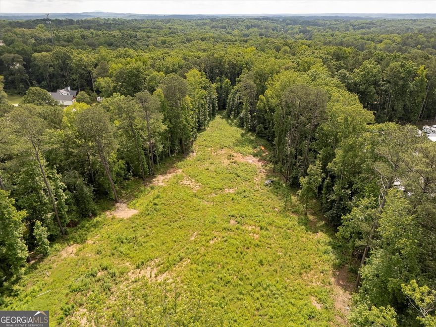 Excellent opportunity to build your dream home!!! 3.26 acres zoned R80 in the prime location of Woodstock close to HWY 140 with easy access to Milton/Roswell/Alpharetta and Canton. No HOA. Property is mostly cleared with utilities available! Located in the desirable Avery/Creekland/Creekview school district!