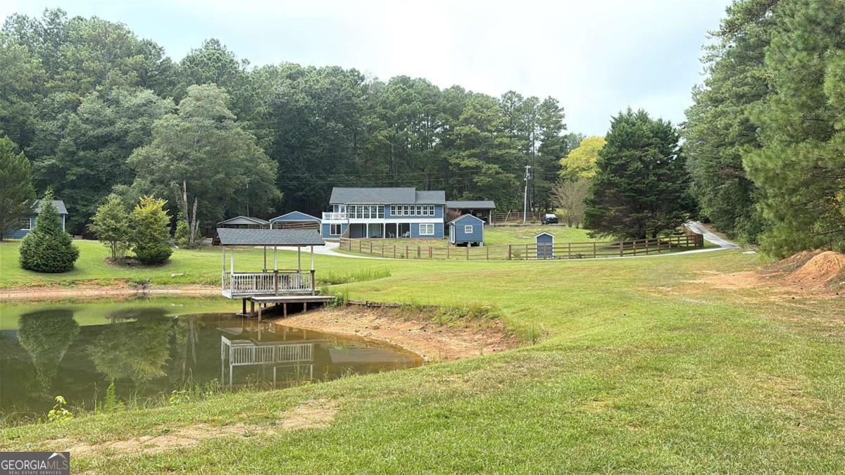 Hunters Paradise or Development Opportunity! Welcome to 91 Goodlin Rd, an incredible 8.7-acre tract offering endless potential. This private retreat features a meandering stream and a small lake complete with a swimming platform-perfect for outdoor enjoyment. Investors and developers take note: the property is large enough to accommodate 6-7 potential lots. Whether you're seeking a secluded getaway, hunting retreat, or your next development project, this property delivers.