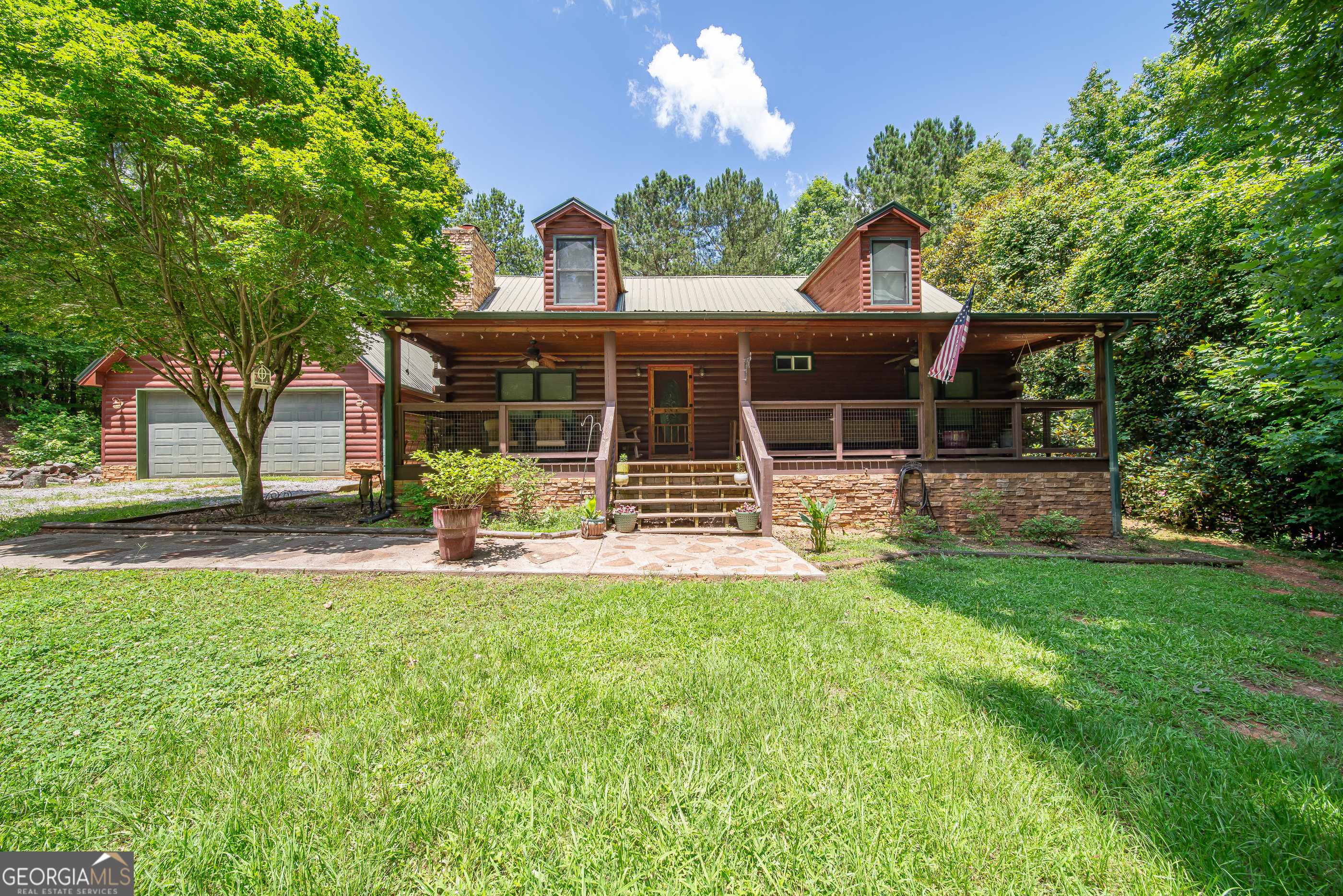 Welcome to your private retreat on Savior Lane. Tucked into the trees of the quiet Mountain Shadows community, this charming log cabin offers the perfect blend of rustic warmth and peaceful surroundings. Whether you're sipping coffee on the wraparound porch or warming up by the fireplace, every inch of this home speaks serenity. Inside, you'll find natural wood tones, vaulted ceilings, and cozy spaces perfect for full-time living or a weekend getaway. The peaceful neighborhood is home to the Mountain Shadows Community Church, creating a warm, small-town atmosphere that's just minutes from Callaway Gardens, Pine Mountain shops, and FDR State Park. Ideal as a primary residence, second home, or income-producing vacation rental. Let nature be your neighbor. Come experience the peace of Savior Lane.