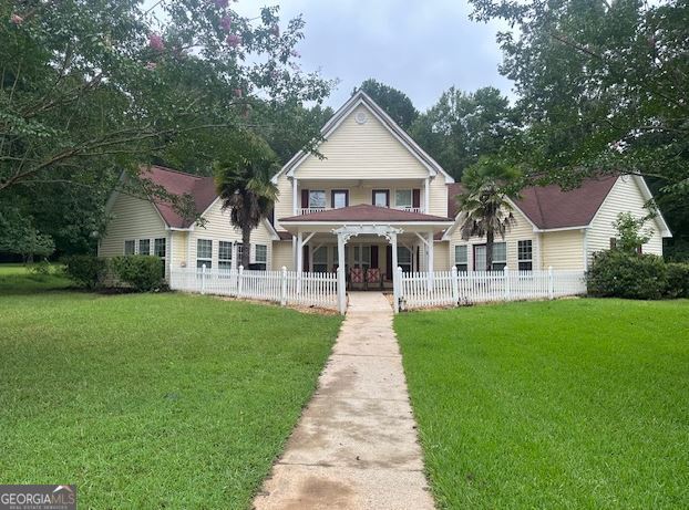 REDUCED BELOW MARKET! This beautiful custom house offers 6 bedrooms, 3.5 baths plus a large bonus/game room and two car garage. Lakeviews from the master, den and upstairs bedrooms. Situated on a level lot with stunning big water views of Lake Sinclair. At the waters edge enjoy a seawall, double boathouse with lifts, firepit area and seating area. Whether enjoying morning coffee under the lakeside porch, or enjoying a drink at the waters edge, you will not find prettier views than this lot offers. This property also has short term rental history. Seller is motivated.
