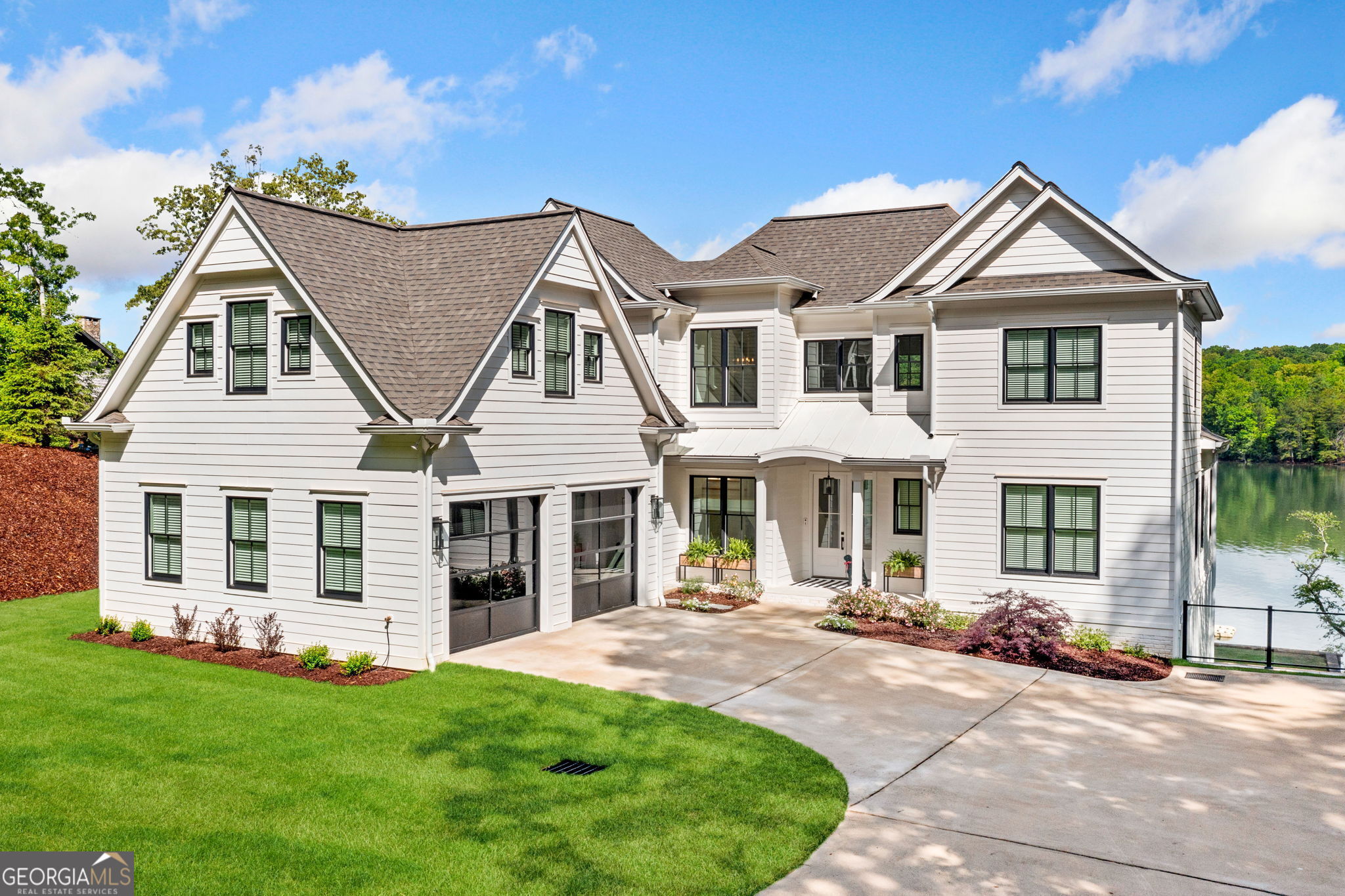 Luxury Lakefront Living in this 5 Bed 5.5 Bath Home! This stunning custom home offers upscale comfort and premium amenities throughout. Enjoy marble countertops in the kitchen and all bathrooms, a Hallman Professional stove, Thermador refrigerator, Newair beverage cooler, and Summit ice machine. Two 50-gallon water heaters and dual laundry rooms add convenience. Interior highlights include Anderson 400 Series windows, Thibaut designer wallpaper, gas fireplace, and a media room wired for surround sound. Whole-house audio by URC and Lennox HVAC ensure year-round comfort. Step outside to a 2-story Wahoo deck with WiFi, Hunter irrigation system, deep water dock with 2 boat slips, 2 jet ski lifts, and you're just 10 minutes from downtown Blue Ridge.