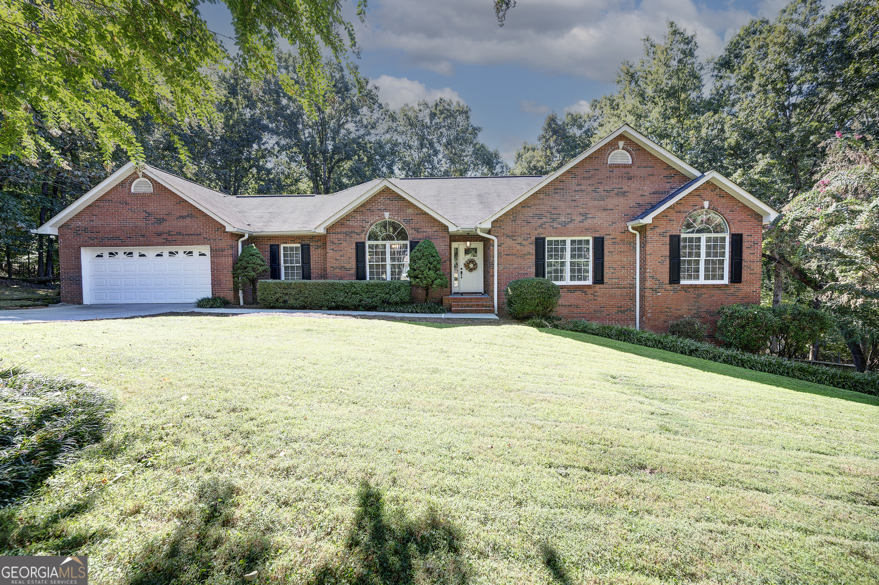 EXQUISITE RANCH OVER BASEMENT IN AMAKANATA WITH MULTI-GENERATIONAL LIVING POTENTIAL! This beautiful, BRICK-FRONT abode is nestled upon a SPACIOUS LOT in Thornwood at Amakanata Estates, centrally positioned off of Lovers Lane Road, and convenient to schools, shopping, dining, medical, and local attractions. Step inside to the FABULOUSLY FLOWING FOOTPRINT, to be welcomed into the LIVING ROOM, which is a spacious setting for both entertaining and everyday lounge. NATURAL LIGHTING illuminates the space, and brilliant OAK HARDWOODS are towered by VAULTED CEILINGS with a VENTLESS GAS LOG FIREPLACE serving as the focal point, providing a romantic ambiance for snuggling in on those crisp, Autumn mornings. The MAGAZINE-WORTHY KITCHEN is a cook's delight, complete with: QUARTZ COUNTERS; STAINLESS APPLIANCE PACKAGE, including DOUBLE OVEN electric range with custom VENT HOOD above; Microwave, Dishwasher; and REFRIGERATOR. The PREP ISLAND also doubles as a BREAKFAST BAR, with room for seating 4, and the contrasting palette provides a timeless feel. The SPACIOUS LAUNDRY/UTILITY ROOM conveniently connects the 2-CAR GARAGE to the kitchen for unloading groceries with ease. Enjoy casual meals in the BREAKFAST ROOM, which is positioned amidst BAY WINDOWS and open to the kitchen, and enjoy more elegant entertaining in the FORMAL DINING ROOM, which is open to the living room. The LARGE AND LUXURIOUS OWNER'S SUITE, reminiscent of 5-star accommodations, is a soothing sanctuary to begin and end the day. Its magnificent bedroom boasts DOUBLE TRAY CEILINGS with RECESSED LIGHTING, and opens to the opulent ENSUITE. Its features include: Gorgeous TILE SHOWER with FRAMELESS GLASS ENCLOSURE; FREE STANDING TUB; and DOUBLE VANITIES, which flank a handy storage tower. A WALK-IN CLOSET is also in place for storing many fashions. The SECONDARY BEDROOMS are generously-sized, each with its own WALK-IN CLOSET, and share a hall bath with tub/shower combo. Enjoy FALL FESTIVITIES on the SPACIOUS BACK DECK, overlooking the PRIVATE BACKYARD with ESTABLISHED GARDEN bed. The LOWER LEVEL provides a SEPARATE LIVING QUARTERS, complete with its own PRIVATE 1-CAR GARAGE and SEPARATE DRIVEWAY. A spacious REC ROOM is in place, which would also make for a great LIVING ROOM and/or 4TH BEDOOM, as well as a FLEX SPACE (perfect for HOME OFFICE), and a FULL BATHROOM with WALK-IN SHOWER. This home is also equipped with a TANKLESS WATER HEATER, offering an endless supply of hot water. Experience the ultimate blend of elegance and functionality in a home designed to bring everyone together, while providing privacy, comfort, and luxury. Don't miss the opportunity to call 175 Thornwood Drive your FOREVER HOME!
