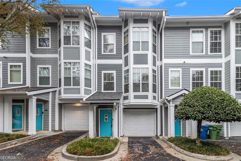 Welcome home to your BeltLine retreat!  This spacious, move-in ready gated townhome is just two blocks from the Atlanta BeltLine and a short stroll to Grant Park - the perfect mix of convenience and calm. Tucked away at the rear of the community (away from Boulevard) and only a few doors down from the pool and community grill, this home offers privacy and peaceful living.  Step inside to find tile and gleaming hardwood floors throughout. The first level includes a one-car garage and a flexible bonus room - ideal for a home office or gym. Upstairs, hardwood stairs lead to an open-concept main level featuring a sparkling half bath, a bright kitchen with stainless steel appliances and gas cooking, dining and living areas, and a private rear patio for relaxing or entertaining. The top floor hosts the owner's suite with a walk-in closet, a spacious bath with jetted tub, separate walk-in shower, and conveniently located laundry.  Recent upgrades include: Wi-Fi Alexa-compatible thermostats New downstairs AC unit (outdoor) Tankless water heater Comfort-height toilets Updated millwork knobs and bathroom lighting LED under-cabinet lighting and adjustable recessed LEDs New refrigerator New washer/dryer (2025) New roof (2024) Ring doorbell  This is your chance to own a beautifully updated home in the heart of the Grant Park/Boulevard Heights area - all at an incredible value.