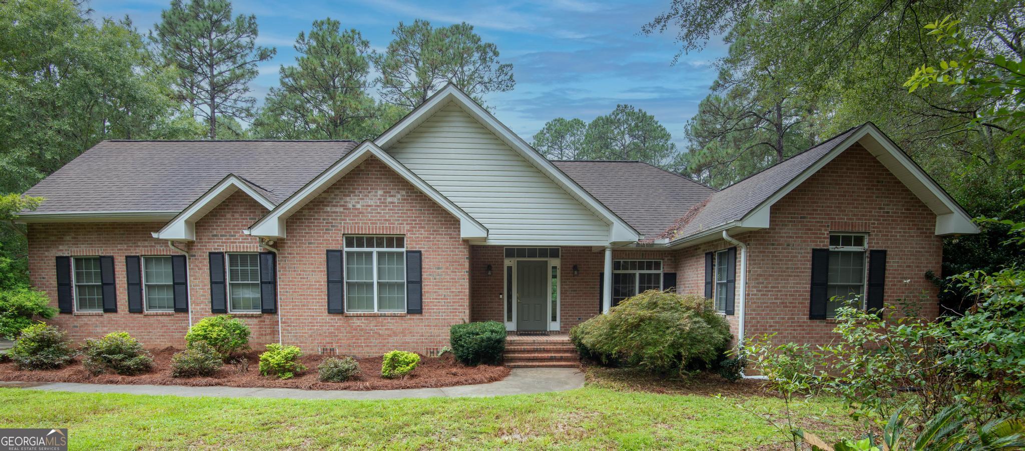 Classic, brick home in the peaceful Westridge neighborhood. Beautiful hardwood floors throughout the main living areas. The spacious great room features vaulted ceilings, custom built-ins and a gas fireplace. Enjoy relaxing or entertaining on the large screened-in back porch overlooking a private backyard. The updated kitchen includes stainless steel appliances, tile backsplash and a breakfast area. Formal dining room off the kitchen. The primary bedroom offers hardwood floors, a walk-in closet and a spa-like bath with a soaking tub and tiled rain shower. Two additional bedrooms share a hall bath with double sinks. Large upstairs bonus room could be a fourth bedroom with its own full bath. This home also includes a laundry closet, ample storage, a two-car garage, and attic space. One year home warranty provided for the buyer.