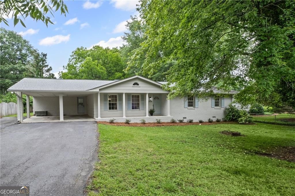 Charming Updated Ranch in Downtown Alpharetta! Welcome to 1830 Mayfield Road a beautifully renovated 3-bedroom, 2-bathroom ranch-style home located less than a mile from the vibrant heart of Canton Street. Nestled in one of Alpharetta's most sought-after communities, this home offers unmatched access to an array of local shops, dining, and entertainment options, all while providing a peaceful retreat to come home to. This delightful 4-sided brick home showcases a modern open-concept floor plan that seamlessly connects the living and family room areas perfect for entertaining or everyday comfort. Step inside to enjoy a fresh designer palette with new interior and exterior paint, luxury vinyl plank flooring, and oversized baseboards that add to the home's contemporary feel. Stylish touches throughout include a board and batten feature wall in the family room and shiplap accents in the guest bathroom. The kitchen and bathrooms shine with quartz countertops, new tile, and a completely updated primary bathroom featuring a spacious walk-in shower and modern vanity. Enjoy cooking and gathering in the kitchen with all-new stainless-steel appliances, including a range, dishwasher, and microwave. Additional upgrades include new lighting fixtures, recessed can lighting, and a ceiling fan for year-round comfort. Step outside to relax in the inviting 3-season porch or enjoy the expansive, flat backyard perfect for entertaining, gardening, or play. The outdoor space has been thoughtfully enhanced with new landscaping, including the addition of azalea and gardenia bushes that bring seasonal color and fragrance to the yard. Pre-built planters and two storage sheds add both beauty and functionality to this impressive outdoor retreat. With its thoughtful updates, timeless charm, and prime location in Downtown Alpharetta, this home is truly move-in ready. Don't miss the opportunity to own this beautifully updated gem in a community known for its exceptional quality of life!