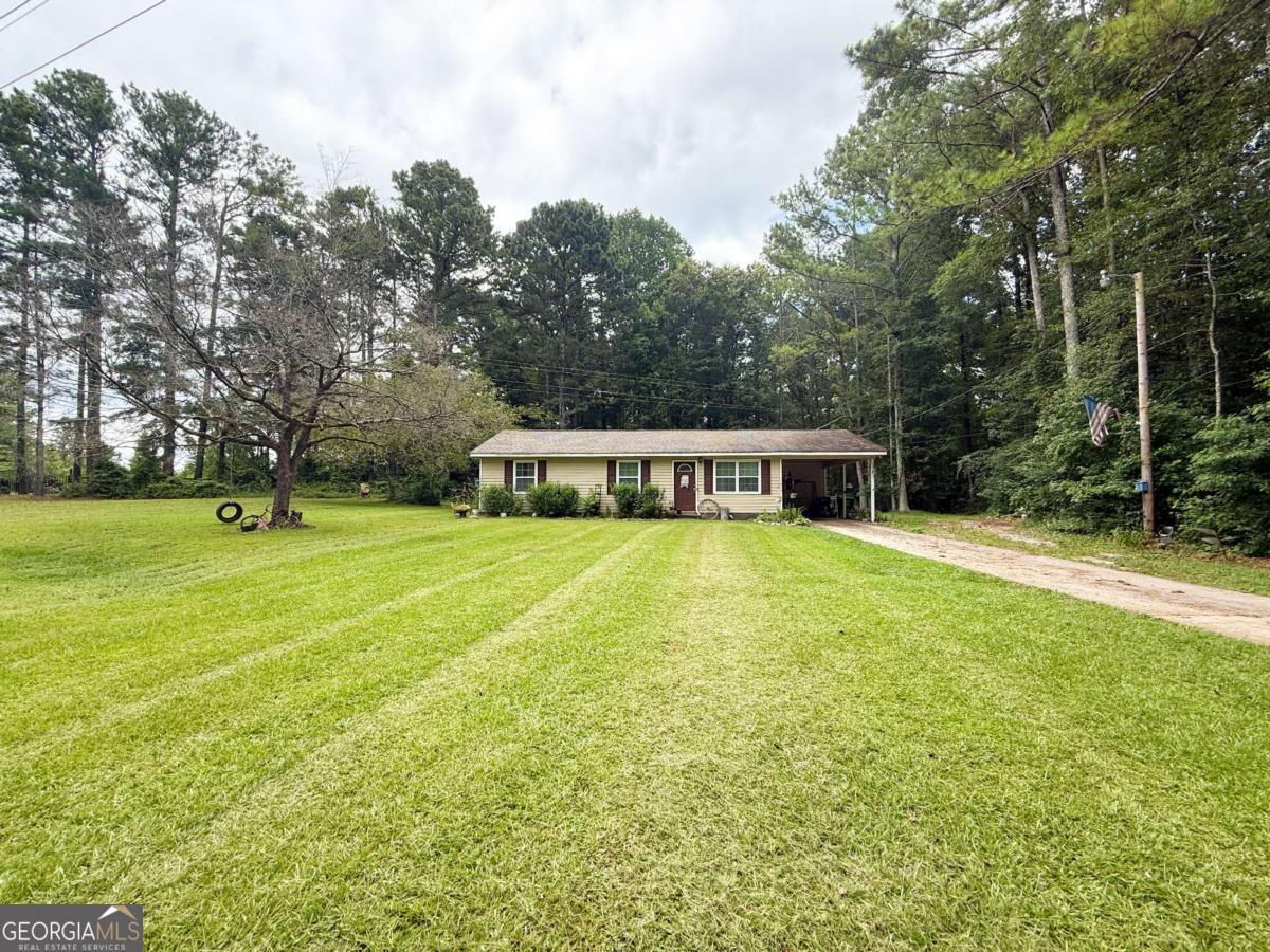 Welcome home! Beautiful 3-bedroom, 1-bath ranch-style home nestled on a serene 2-acre level lot. With a spacious front and back yard and a wooded perimeter offering the perfect blend of open space and privacy. Located in Temple High School district, ideal for those seeking both convenience and tranquility. Step inside to a warm and inviting layout featuring a family room that flows effortlessly into a cozy country kitchen and dining area, perfect for everyday living. The home offers central electric heating and cooling, a mix of LVP and carpet flooring and a dedicated laundry room conveniently located off the kitchen. Outside, you'll love the fully fenced backyard, great for kids, pets, or your own outdoor retreat. The surrounding wooded areas provide additional seclusion and potential for expansion, gardening, or simply enjoying the peace and quiet of nature. Located in USDA-eligible area, no down payment required for qualified buyers! Don't miss your chance to make this charming home yours. Call today!