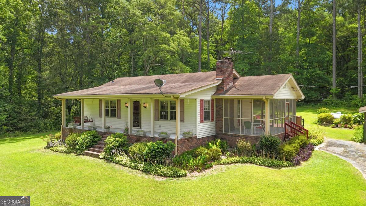 This charming country living home was built, owned and has been occupied by one family. The 2.70 acres has an amazing view. You can sit on the front porch or the large screened in porch and enjoy the scenic view of trees, plants, flowers, creeks, and even a lake. It offers country living, but it is also convenient to Thornton Road which leads to Hartsfield-Jackson Airport, Interstate 20, Six Flags over Georgia and much more. It offers a three car carport which compliments the house. Downstairs you will find a one car garage, storage space, a workshop area, wood burning stove and space for an extra bedroom, bonus room, man cave, etc. The water heater was recently installed. Come see, it is a rare find in Powder Springs.