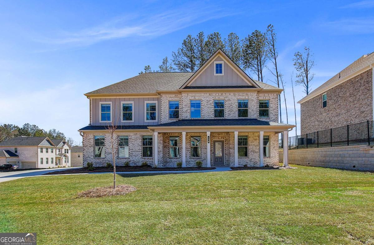 Welcome to Cambria at Traditions by DRB Homes in the desirable Hampton, GA area within Henry County. This beautifully crafted single-family home features a charming craftsman-style exterior and leaves no detail overlooked. The spacious Stonefield plan, located on Homesite 5, offers 5 bedrooms and 3.5 bathrooms. The main level includes an open kitchen and family room concept with a large island, and an office/study and powder room. Upstairs, you'll find a versatile loft area, three generously sized secondary bedrooms, and a grand owner's suite. The owner's suite includes a luxurious spa bath with a soaking tub, a separate shower, and a walk-in closet. Please note that the photos provided are stock images and do not represent the actual home. Contact us today to learn more and follow the progress of your future home!