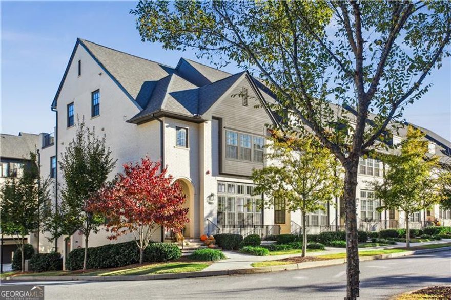 Welcome to Serenade, a coveted gated community in Alpharetta offering the perfect blend of luxury, convenience, and low-maintenance living. This rare end-unit townhome features high-end finishes and thoughtfully designed spaces throughout. Enjoy resort-style amenities including a pool, clubhouse, walking trails, and direct Alpha Loop access. The open-concept main level offers bright, spacious living and dining areas that flow seamlessly into the chef's kitchen with quartz countertops, premium appliances, ample cabinetry, and a large island perfect for gatherings. A flexible elevator shaft provides the option to install an elevator in the future or use the space for generous storage. Multiple outdoor areas include a main-level deck and private rooftop terrace, ideal for relaxing or entertaining. The lower level is perfect for guests with a full bedroom, bathroom, and separate living area. The main level includes a formal living room or office. Upstairs, the third level features an oversized primary suite with a spa-like bath and walk-in closet, plus a guest bedroom with en suite bath. The fourth level offers additional flexibility with a large bonus room that can serve as an extra bedroom, office, gym, or lounge with access to the rooftop deck. The garage features upgraded epoxy flooring and ample space for parking and storage. This stunning home offers the best of upscale living in a sought-after gated community, just minutes from Avalon, Ameris Bank Amphitheatre, parks, and top-rated schools.