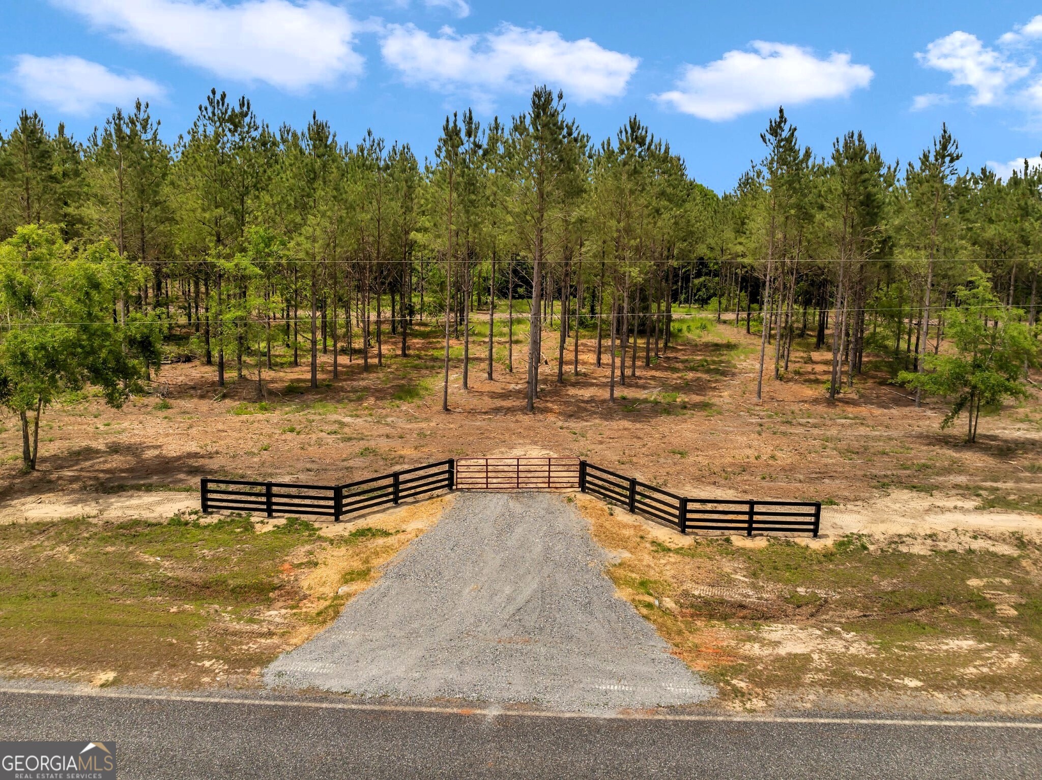 Bluewater offers 19 beautiful country homesites designed for those who value peace, privacy, and the charm of rural living. Lot #4 features 4.942 wooded acres with a small creek crossing the property, creating a serene natural setting where wildlife is abundant. This gated community includes protective covenants, paved road frontage, and access to an excellent public school district. Conveniently located just minutes from downtown Dublin and only 6 minutes from Interstate 16, Bluewater sits halfway between Atlanta and Savannah. With nearby shopping, dining, and entertainment, along with a thriving local economy, it's the perfect balance of country living and modern convenience. Whether you're starting a family or searching for a quiet retreat, Bluewater is the ideal place to plant your roots and enjoy the laidback country lifestyle.