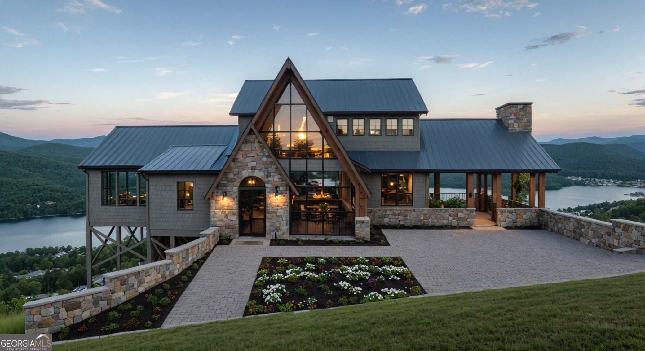 ***Fabulous A-Frame with epic year round views of Lake Burton & surrounding Blue Ridge Mountains to be built by Hafner Construction, Inc. on 1.015 +/- acres in The Summit at Lake Burton*** Experience your own private oasis overlooking beautiful Lake Burton while immersed in the natural beauty of the Blue Ridge of these Southern Appalachian Mountains! Lot 40 is exquisitely positioned in an easy-in, easy-out location from the private, gated neighborhood with the sweetest views of the emerald green waters of the Lake set against its tree-filled mountains and blue skies forever!! Lake Burton's best-kept secret, the Summit is a small, elite community of mostly acre-plus lots. The homesite is located between the Lake Burton Fish Hatchery and LaPrades Marina with its shops & restaurants affording lake access at your fingertips. Additionally, the homesite is convenient to The Waterfall Club, the shops & restaurants of historic Clayton, and all of the boating, fishing, hiking, rock sliding, mountain biking, sunrises, sunsets, and star gazing that this northern Georgia slice of heaven has to offer! Leading into the main vestibule from the front porch the interior elements include a fabulous open living design framed in with rustic timbers, stone fireplaces, and mesmerizing views of iconic Lake Burton -- sought after for its matchless beauty, as it is so well buffered with thousands of acres of National Forests, fed by free-flowing clear, natural streams, and adorned with all of its Flora & Fauna. What a wonderful opportunity to participate and collaborate from the beginning in the creation of your dream home and entertainer's paradise directly above beautiful Lake Burton!! **Features: 3,538 Heated SF 3 Bedrooms (one is bunk room, can slope several) 3.5 Baths Primary Suite on Main Level Metal Roof Natural Stone Accents with Wood Siding Stone Logia 2 Wood Burning Fireplaces Custom Kitchen, Appliances, & Details Custom Steel Glass front & rear A Frame Windows for a Panoramic View Foam Insulation Aluminum Clad Custom Windows & Doors