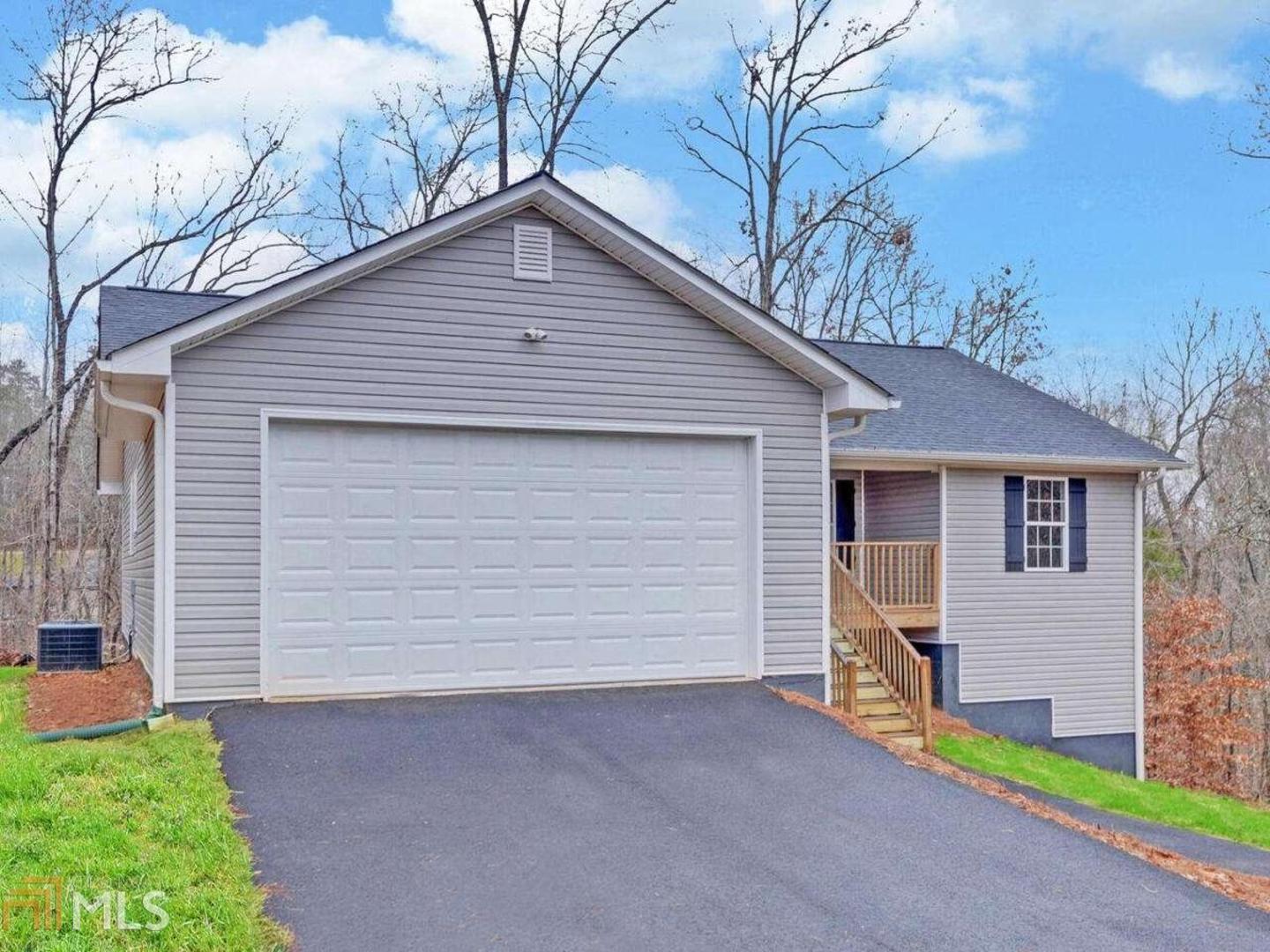 New Construction Ranch in sought after North Hall with NO HOA to bother you. Maintenance free. Stepless home features custom cabinets in the Kitchen and baths. Large Master Suite with jacuzzi tub. Extended deck overlooking a private back yard. Sustainable hardwood flooring throughout. Tiled baths. Unfinished full basement for easy expansion, perfect for even the largest family. Don't miss out! Please schedule through Showing Time. Home has a full year 2/10 New Home Warranty. Home uses the existing septic tank from a previous dwelling but was updated and inspected for a 2 BR with additional fill line.