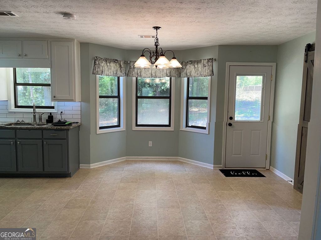 Photo of 1158 Gate Post Lane, Lawrenceville, GA 30044 (MLS # 10669463)