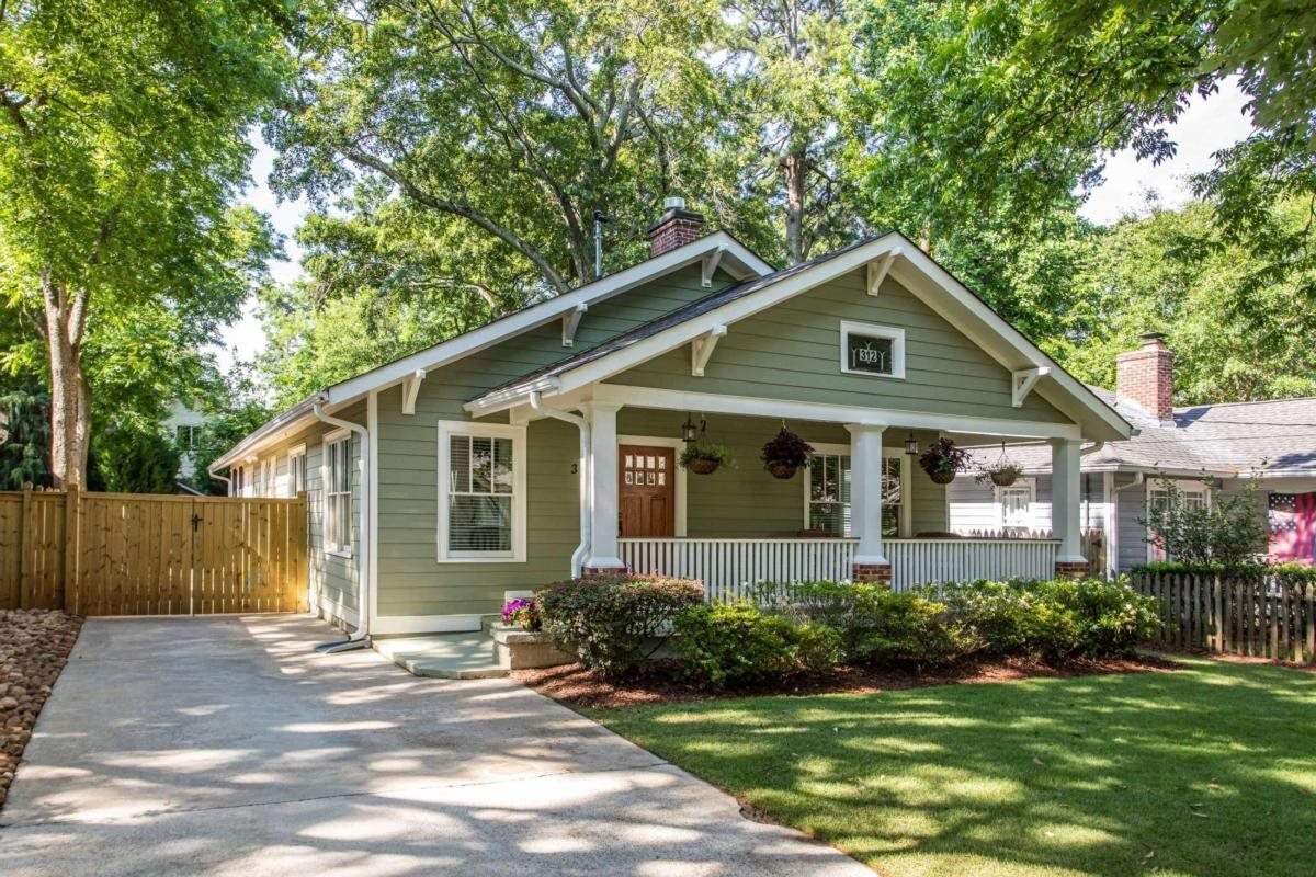 Just two blocks from great dining and shops is this renovated, oversized bungalow featuring one-level living and a backyard built for entertaining and relaxing. Built-in 1925 this classic home includes newer features such as an open floor plan in the public spaces, plenty of storage, good size closets, insulated windows, and upgraded kitchen and baths plus fabulous outdoor, low-maintenance spaces. Step up to the covered porch that stretches nearly from one end of the house to the other.In the rear, you'll find a screened porch that opens to a fully customized grilling kitchen, deck, and yard. This custom feature includes plenty of space for large gatherings and beautiful lighting adding to the enjoyment. There are smart applications from the doorbell to the thermostat in this well maintained, perfectly located treasure in the heart of Oakhurst Village.