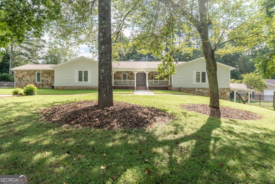 Extremely Desirable Location in Multi-Million Dollar Neighborhood Walking Distance to Downtown Alpharetta and Wills Park, 1~ Mile from Avalon.  Spacious Ranch Home on Large Lot in upscale neighborhood with Large Fenced Backyard.  Covered Front Porch leads to Oversized Fireside Family Room w/ Built-Ins.  Offers Large Eat-In Kitchen w/ White Cabinets, New Granite Counter Tops and all New Stainless Steel Appliances, Large Island & Tons of Cabinet Space.  Oversized Master Bedroom with Private Bath with Improvements and Walk-In Closet. All Bedrooms are Good Size and Offer 2 Separate Laundry Rooms on Each Level- Finished Terrace Level with new flooring, lighting and Second Kitchen, Two Bedrooms/office & Full and Half Bathroom. Within minutes to Downtown Alpharetta and Avalon. Located in a prime area within walking distance of Wills Park; Pool, Tennis, Playground, Baseball field, Basketball Courts, Walking Trails, and Equestrian.  Move in Ready with Newer paint, newer flooring, newer appliances, newer lighting, and upgraded bathrooms features In-law/Teen Suite since... Each Level is a Complete Home.  Large Level Yard with back fenced area and Lots of Extra Paved Parking.