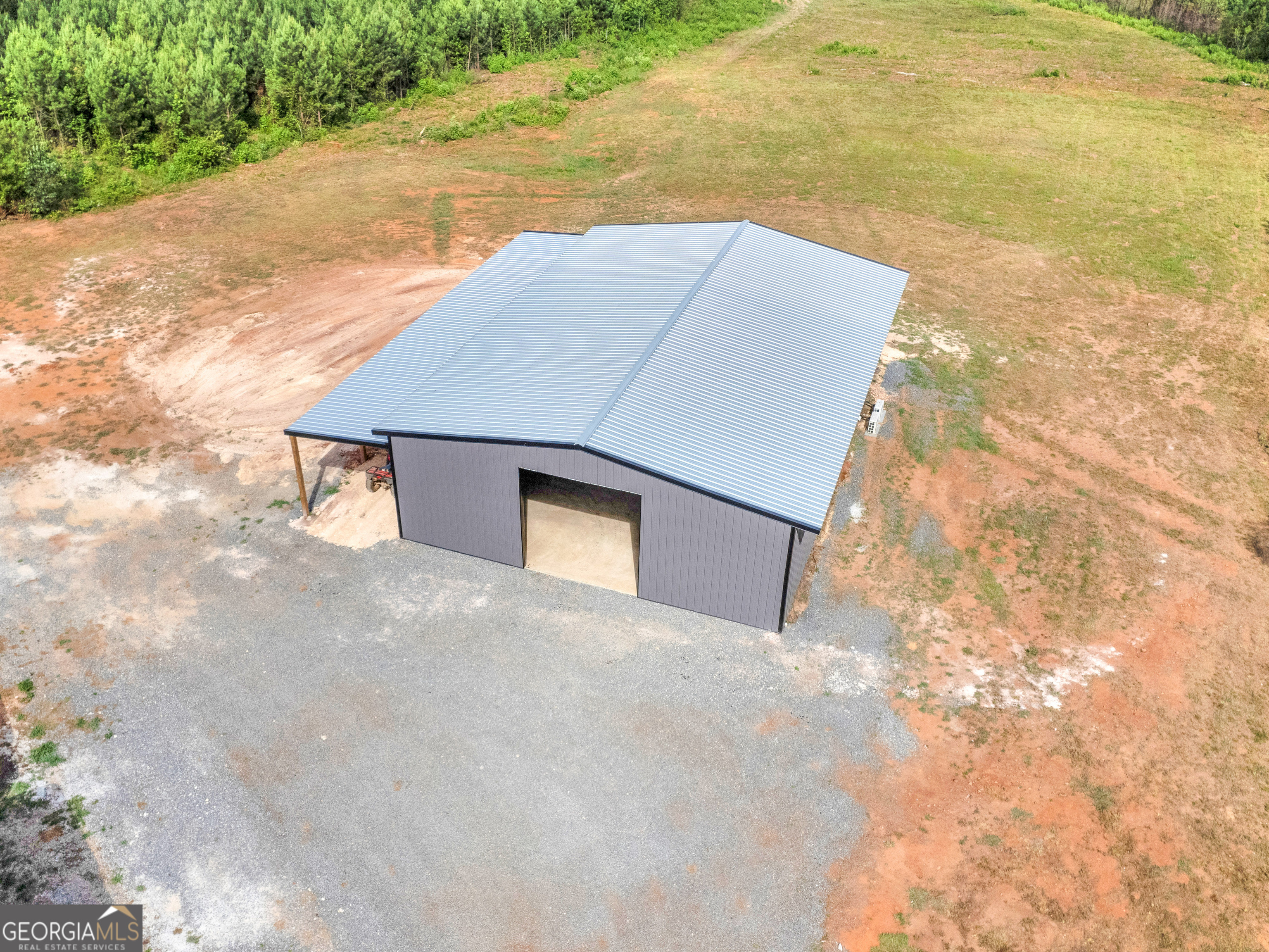 14 Acres in Monroe County. 40X60 shop with 12 ft lean to, well, and power. This property offers creek access and 2 driveways. Less than 6 miles from downtown Forsyth. Make this property your own!